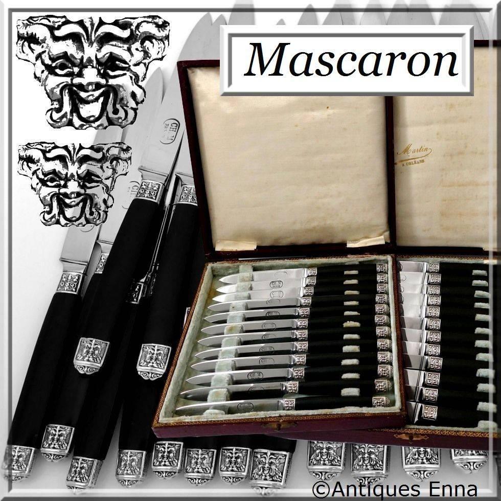 19th rare French ebony sterling silver table knife set of 24 pieces mascaron.

Rare table knife set with ebony handles, sterling silver ferrules and collars with fantastic decoration in the Renaissance style with mascaron.

Both design and