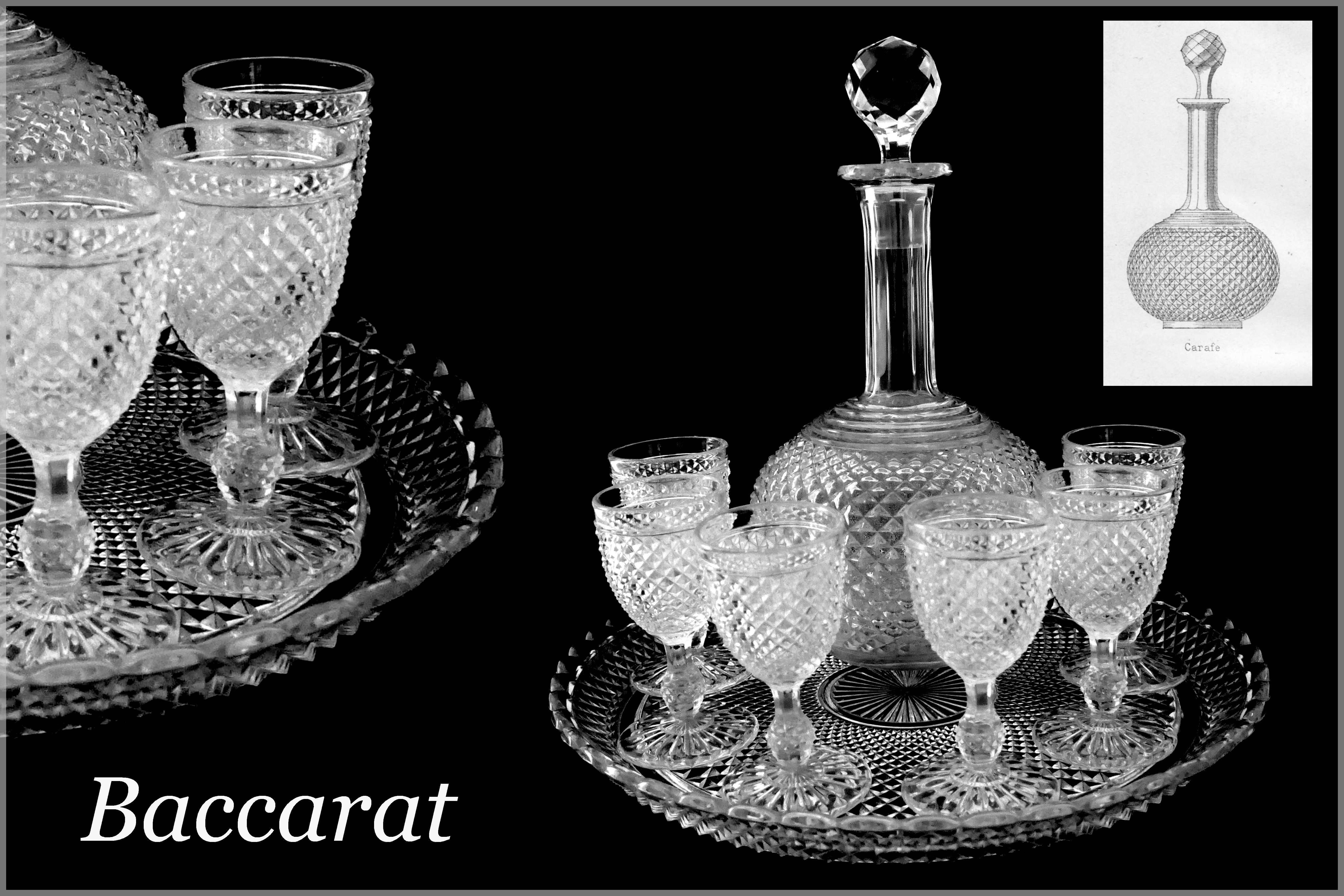 1900 rare Baccarat diamond cut-crystal liquor or aperitif service.

Rare Baccarat crystal liquor or aperitif service with diamond-point motifs comprising circular platter with laced border, six glasses and a decanter. This service is illustrated