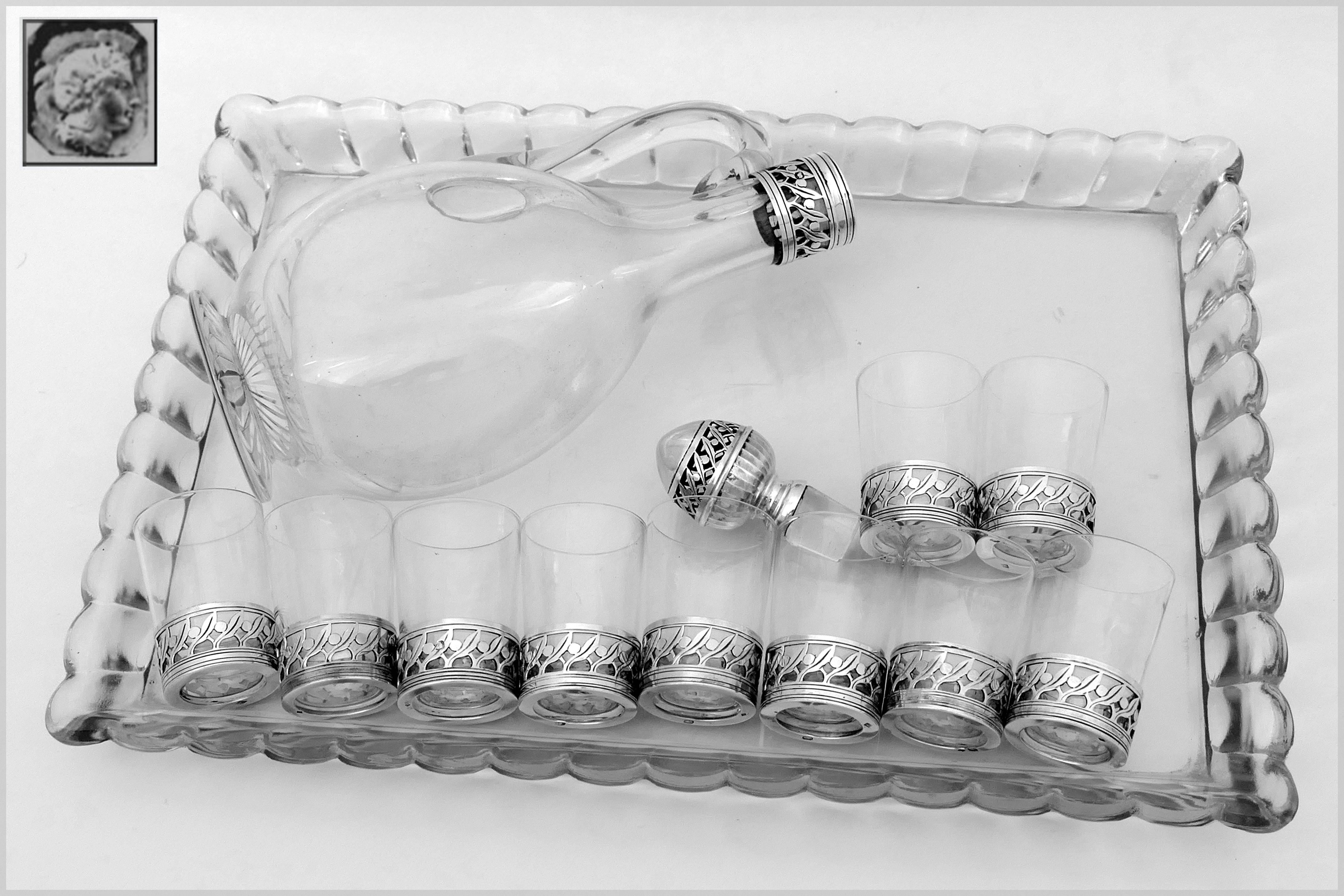 Christofle rare French sterling silver Baccarat crystal liquor or aperitif service 12 pieces.

This service includes ten sterling silver cup holders with ten original Baccarat crystal glasses, sterling silver and crystal decanter and this original