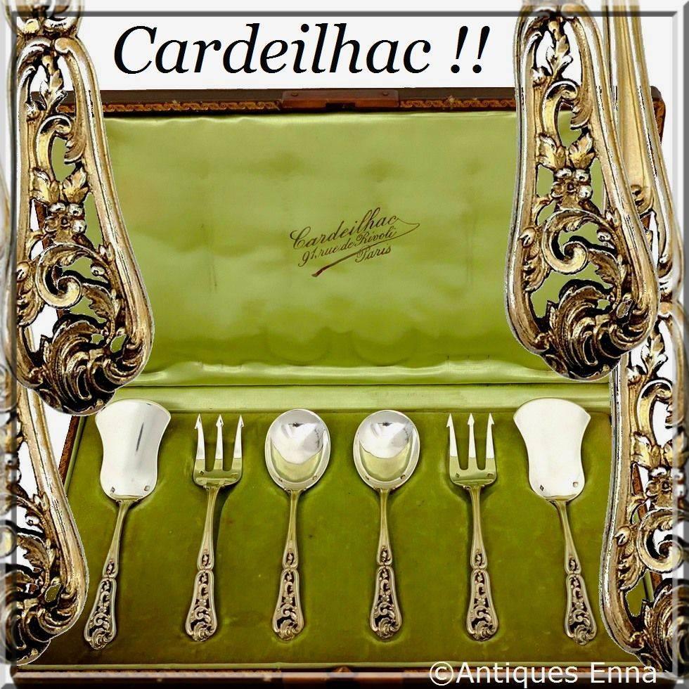 A set of truly exceptional quality, for the richness of its decoration, its form and sculpting. The set includes two spoons, two forks and two servers. It is extremely rare to find a service as complete, probably a special order, it allows to be