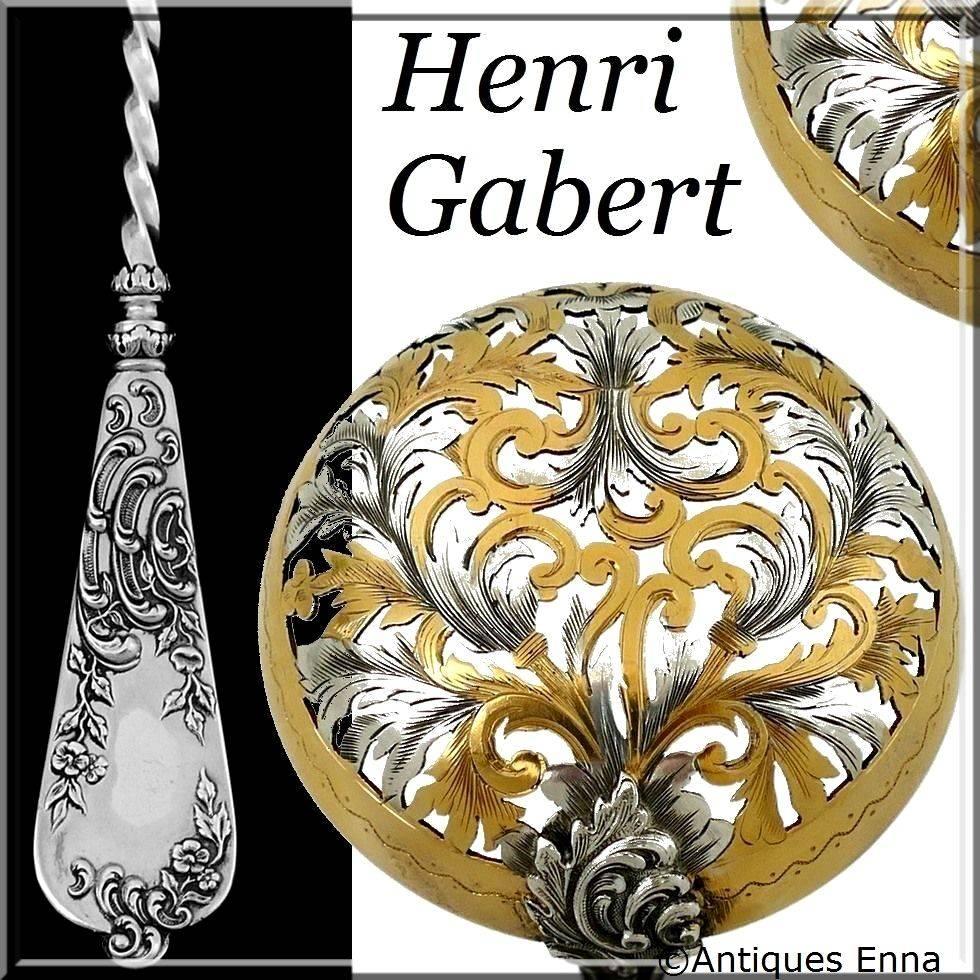 Rare French sterling silver 18-karat gold sugar sifter spoon Rococo.

A spoon of truly exceptional quality, for the richness of its decoration, its form and sculpting but especially for the multi-colored on the upper part. Floral motifs. The stem is