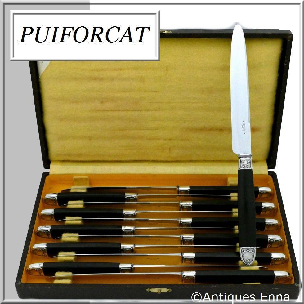 Puiforcat rare French sterling silver ebony dinner knife set of 12 pieces, box, Swans.

Twelve dinner knife set with ebony handles, sterling silver ferrules and collars. Empire style with carved collars on both sides of swan with outspread wings.