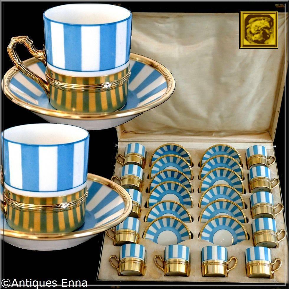 This is a stunning and extremely rare French service of coffee cups including 12 espresso or coffee cups in Sevres porcelain with blue stripes decor, 12 matching saucers in Sevres porcelain and sterling silver 18-karat gold and 12 demitasse in