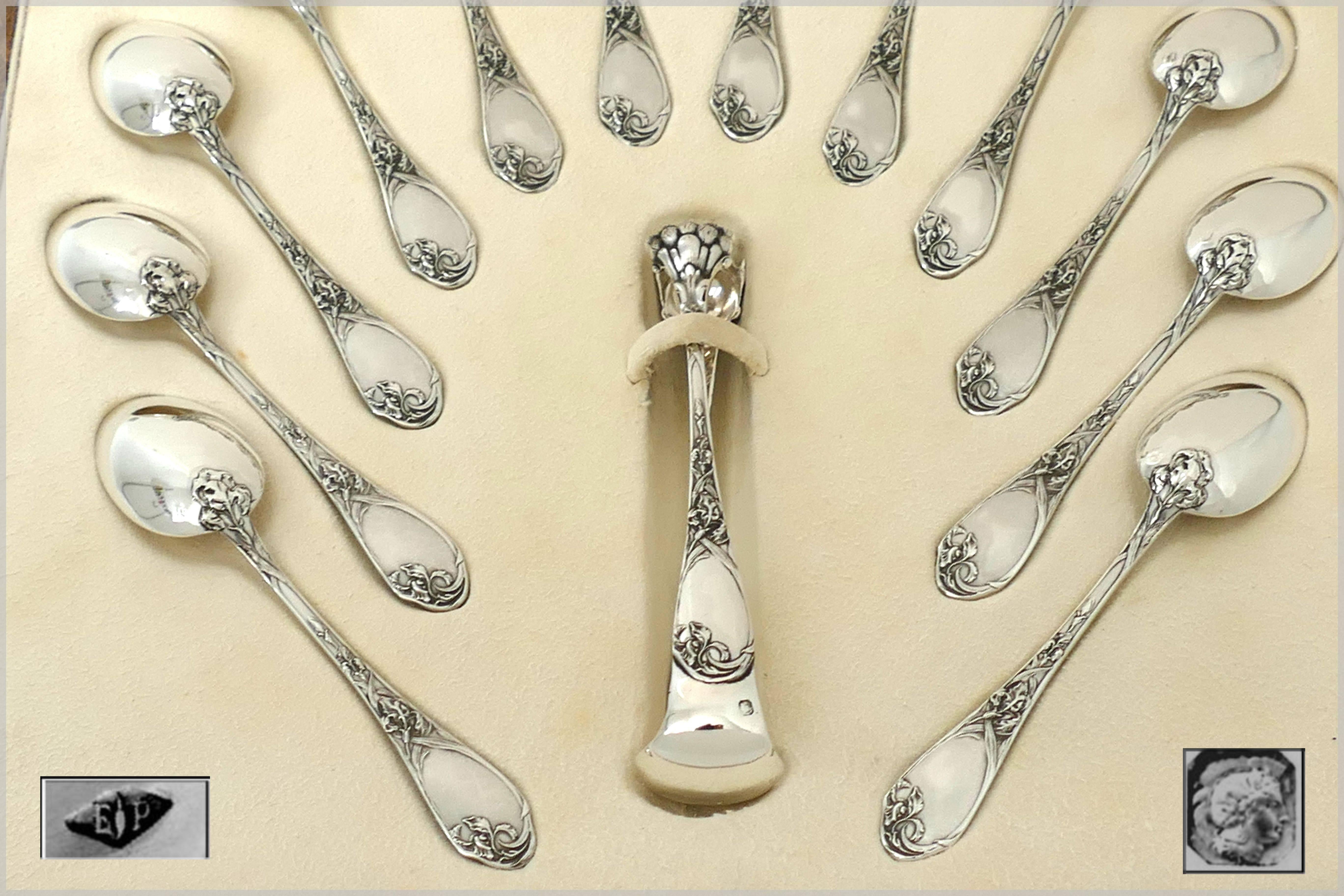 Head of minerve 1st titre for 950/1000 French sterling silver guarantee.

The set have a fantastic iris motif in Art Nouveau style. Finesse of design and quality of execution rarely seen. This service includes a sugar tongs and 12 tea or coffee