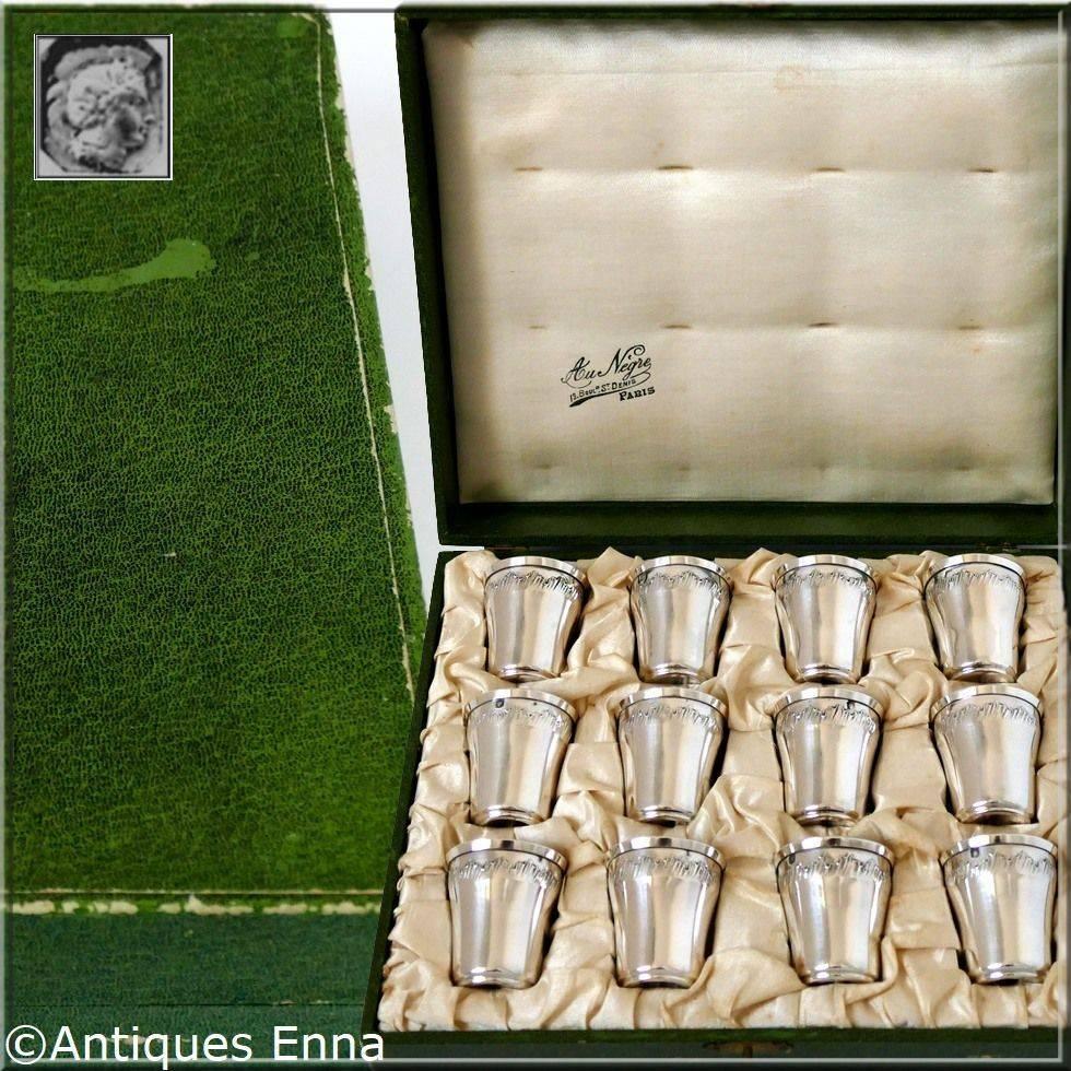Head of Minerve first titre for 950/1000 French sterling silver guarantee. 

This complete set is with its original case with compartments for each piece. The set includes twelve liquor cups in sterling silver. No monograms.

Prestigious