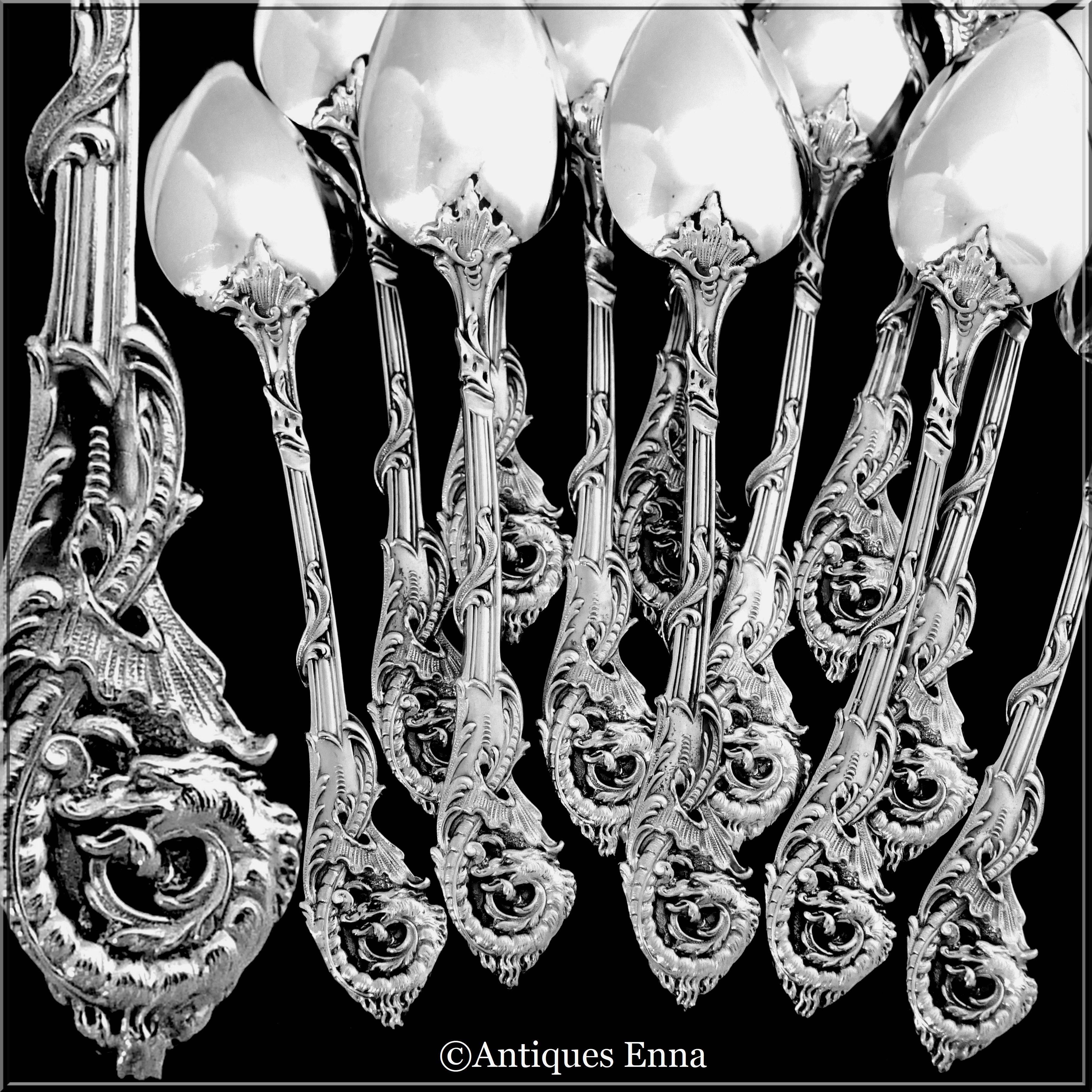 Exceptional tea/coffee spoons set of 12 pieces with embellishments and bowls where the inside is covered with gold 18-karat. The pieced handles have Japonisme style with sculpted dragons.

Pieces with Japonisme decoration are not common and these