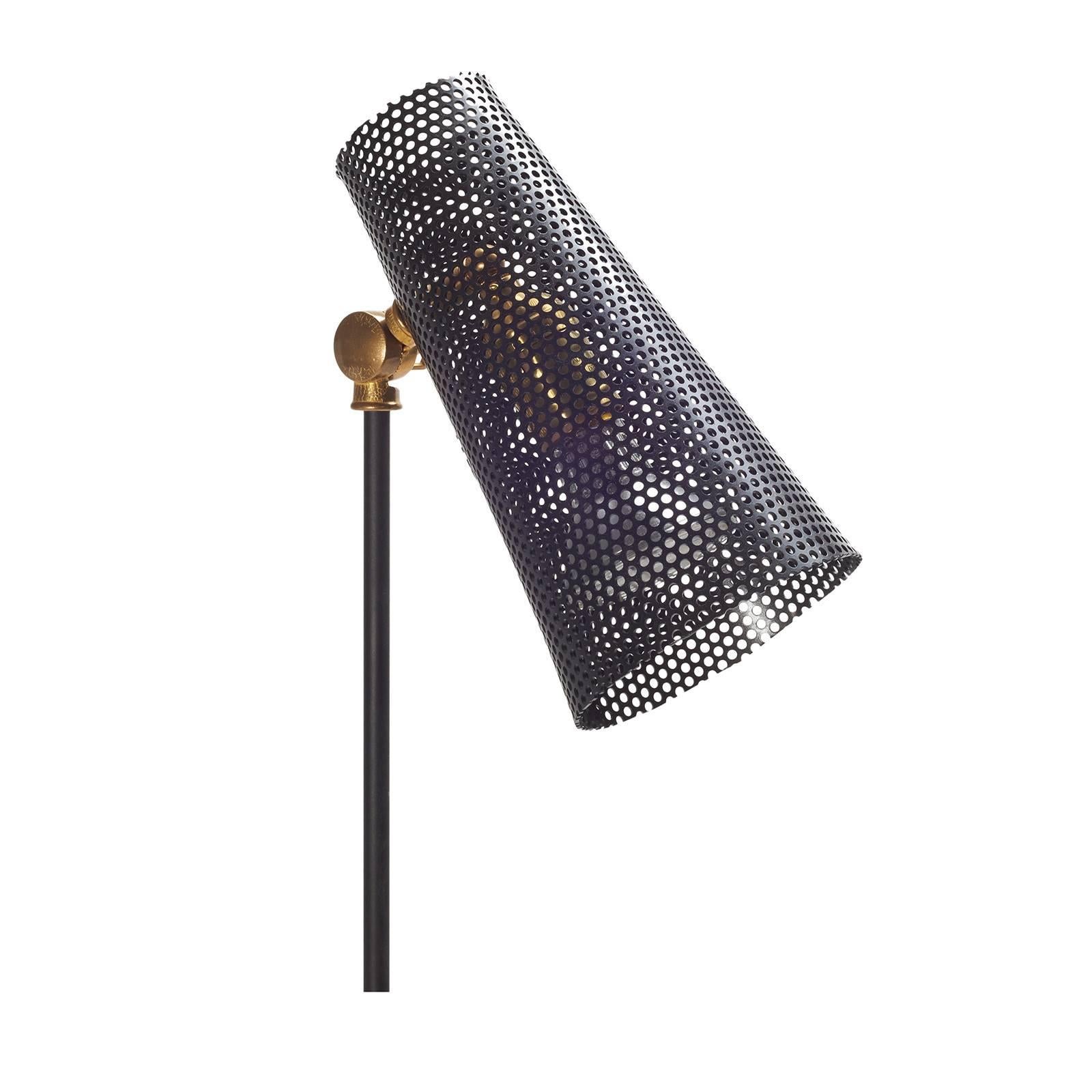 Inspired by Mid-Century design, this floor lamp casts a beautiful patterned light wherever itis placed due to the perforated metal shade. Made by SABIN, a Los Angeles-based designer, this lamp comes in black with brass details.