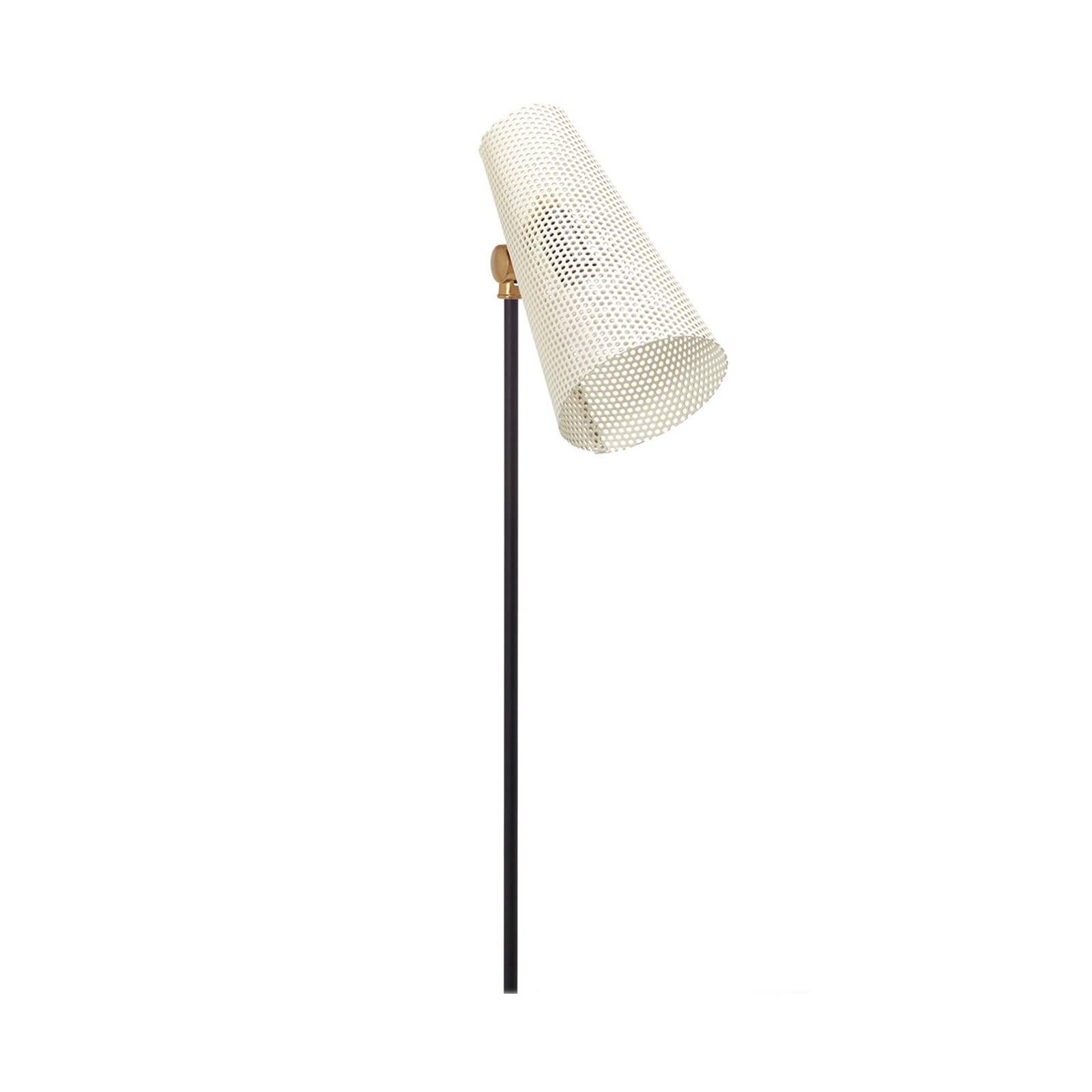 Inspired by Mid-Century design, this floor lamp casts a beautiful patterned light wherever it’s placed due to the perforated metal shade. Made by SABIN, a Los Angeles-based designer, this lamp comes in white with brass details.