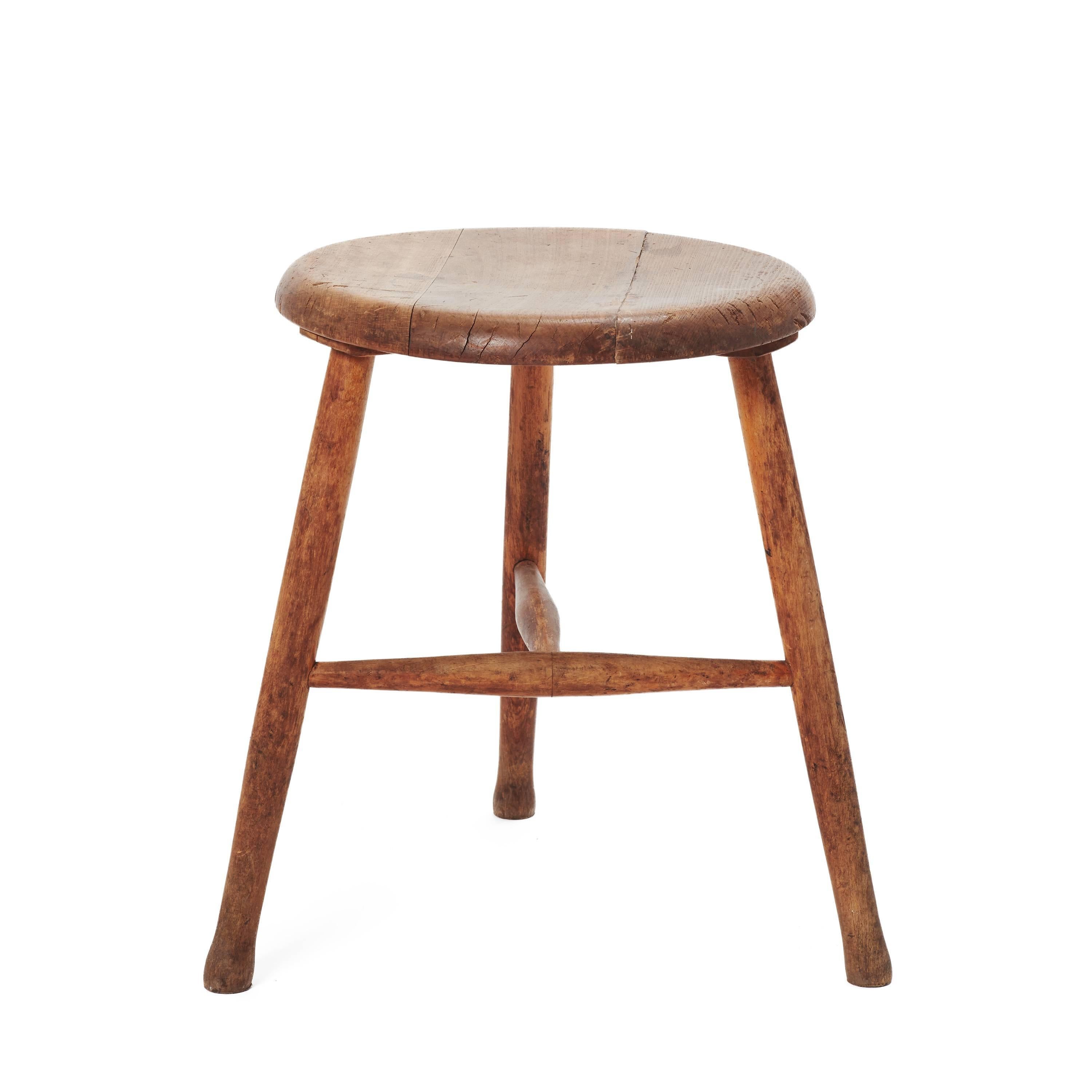 Vintage wooden stool in a grey wash finish. Patina adds charm and character.