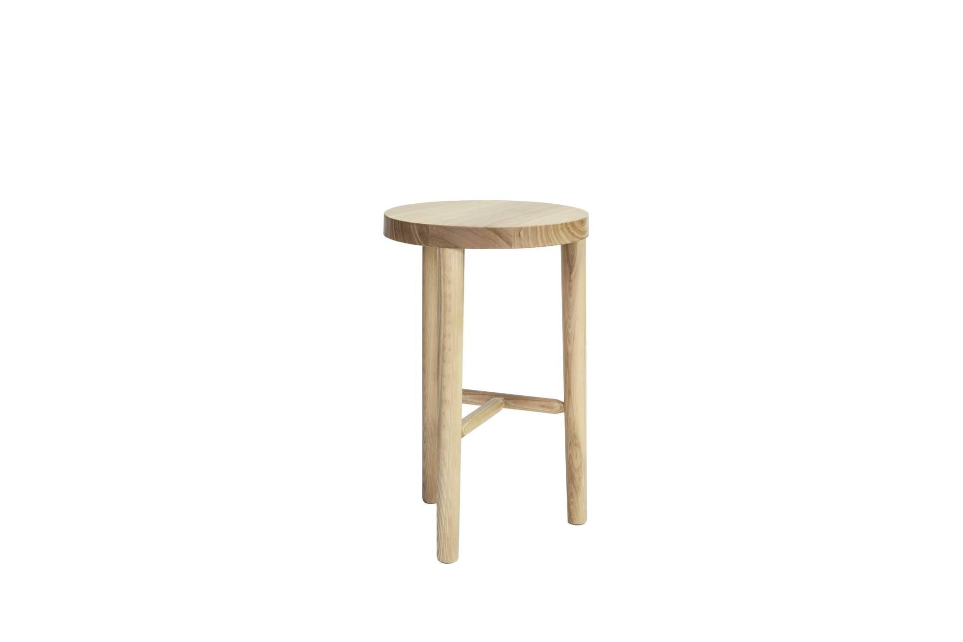 A milking bar stool made of solid white ash and matte clear polyurethane.