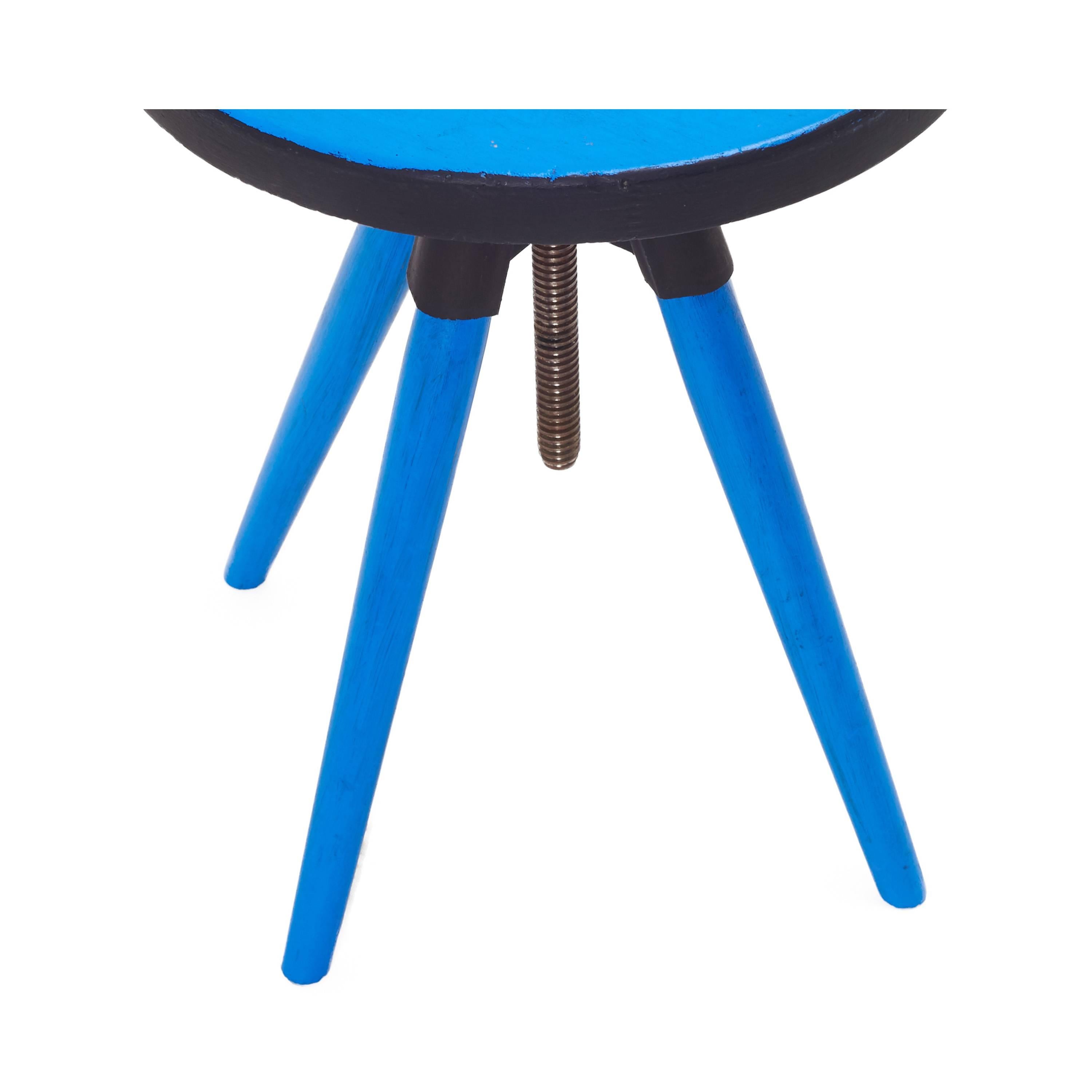 Vintage wood stool painted bright blue with black trim. Turnable Industrial screw which allows for the seat height to spin up or down to the desired height. Natural patina.

Measures: 13.75