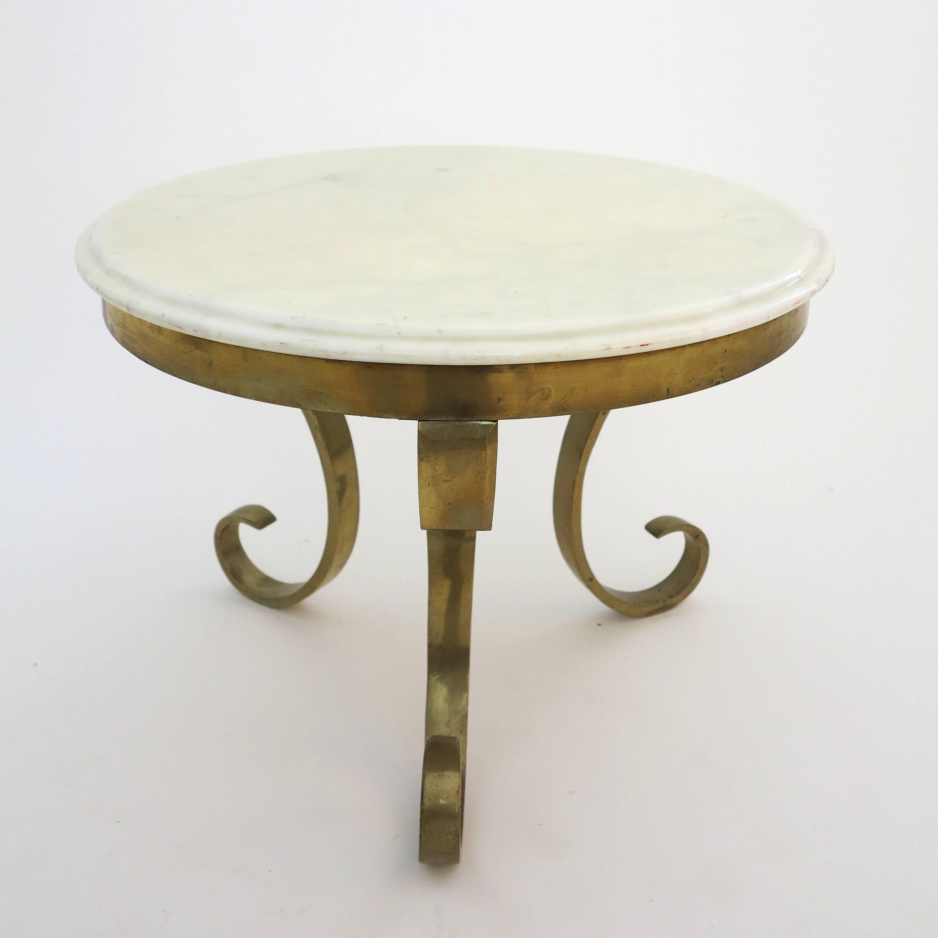 Elegant round side table, manufactured in heavy and solid bronze topped with white marble by Muller´s of Mexico.