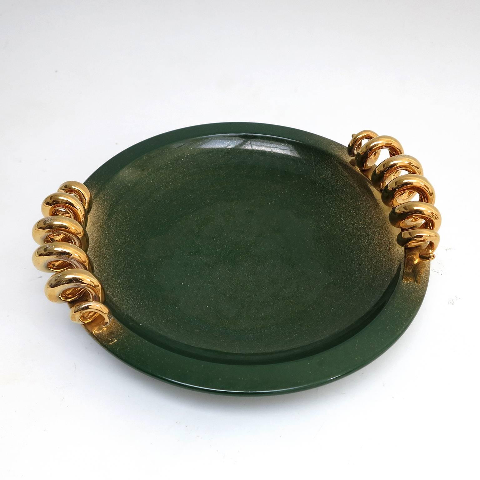 Spectacular salad plate made in green porcelain with two gold dust porcelain handles. It has a matching sauceboat.