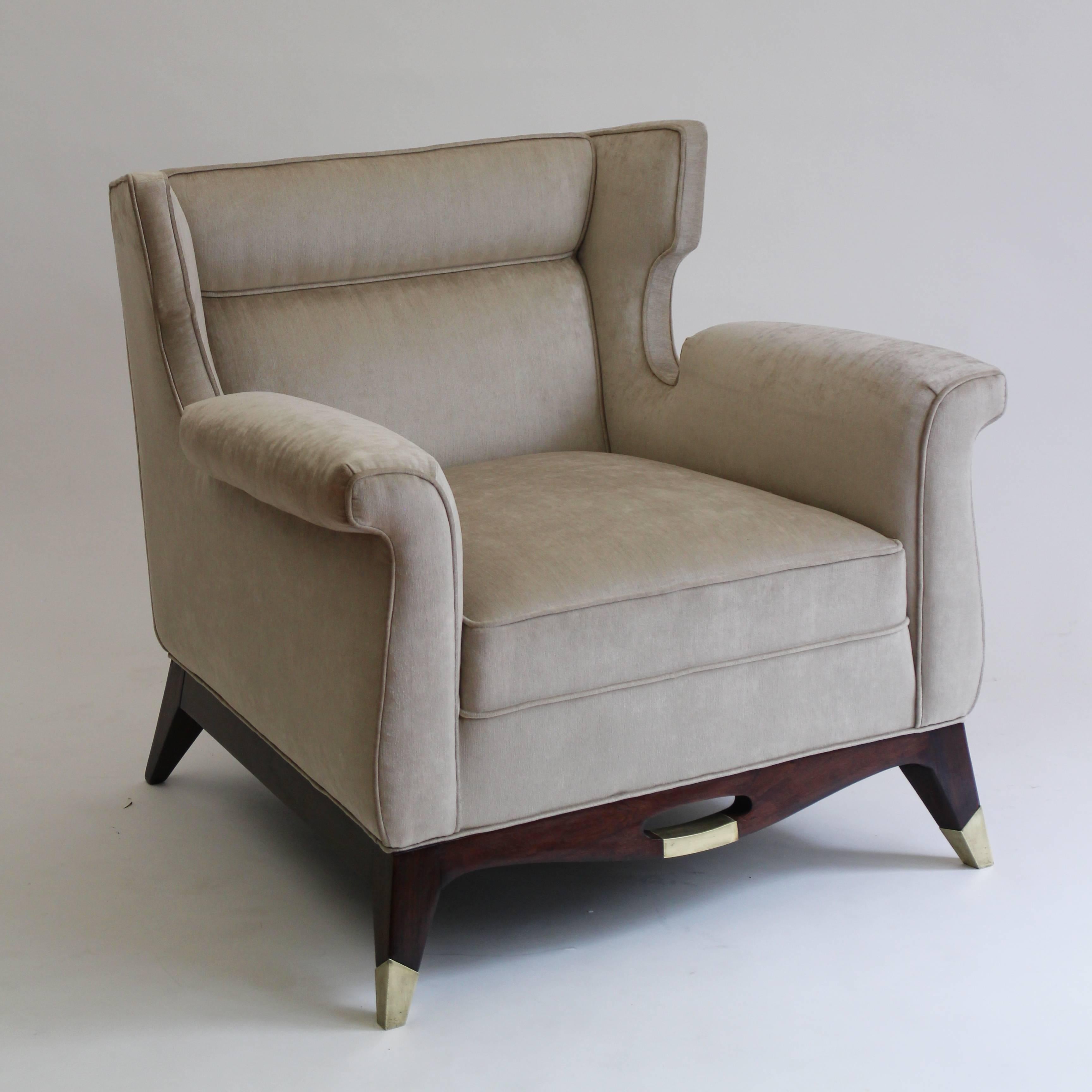 Luxurious and sophisticated pair of club chairs designed by Arturo Pani. Dyed mahogany, bronze sabots and front detail. 

Arturo Pani studied decoration and interior design at the School of Decorative Arts in Paris, and returned to Mexico by 1934