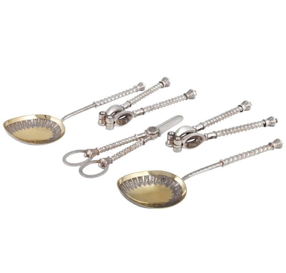Antique Victorian silver plated dessert set in original case, includes two berry spoons, grape shears and two nut crackers. Made By Martin & Hall, one of the premier Victorian silversmiths, England, circa 1890, box is 8-1/2