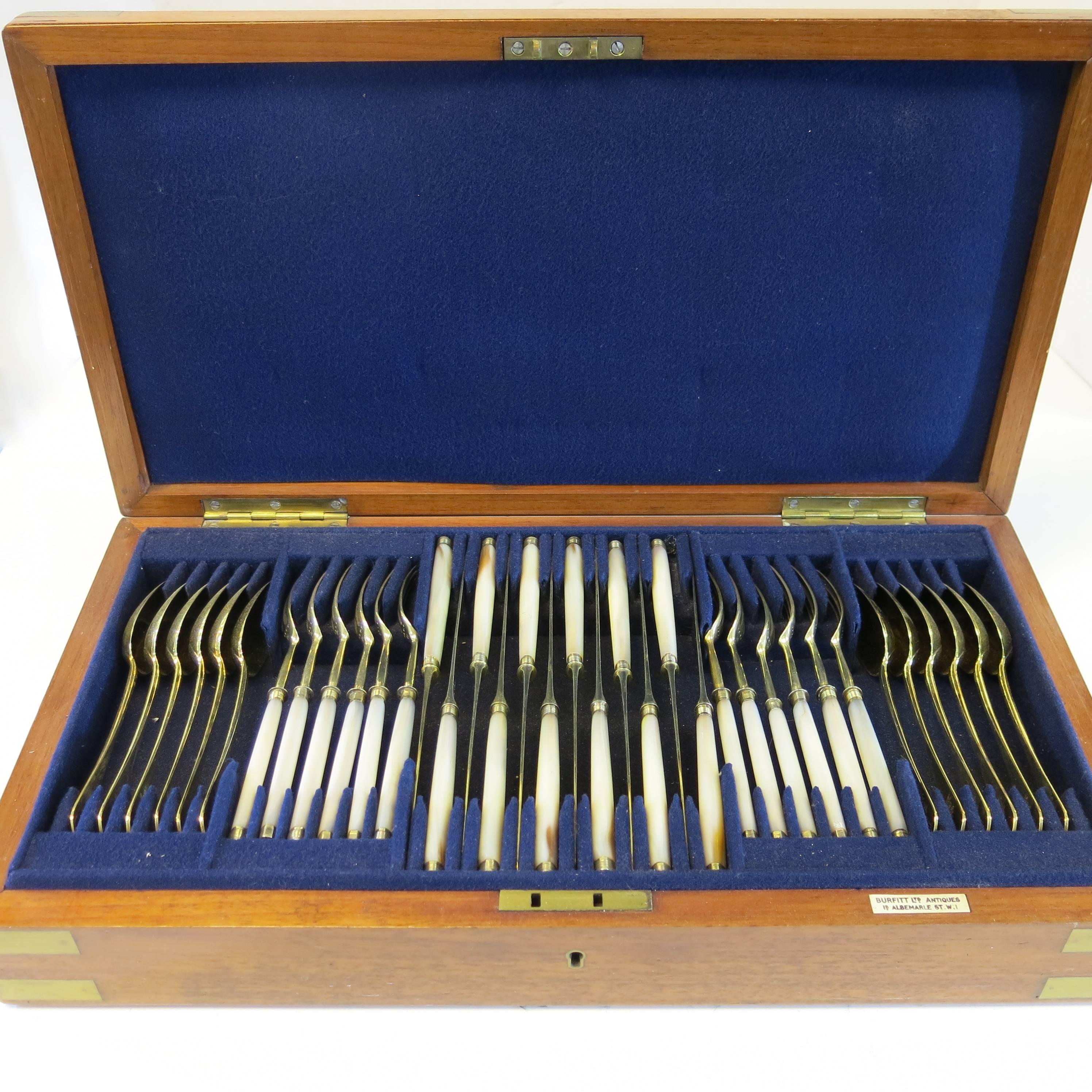 36 piece set, in fitted case. 12 knives & 12 forks with sterling silver vermeil blades and pearl handles, the 12 spoons are all sterling with vermeil. The spoons with hand engraved crest.
The knives hallmarked Matthew Boulton dated 1812, 8