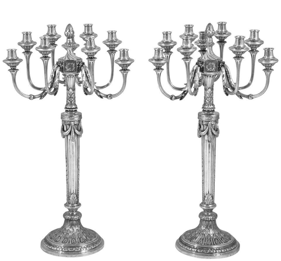 A magnificent and very impressive pair of tall and decorative silver candelabra. Standing 31.5