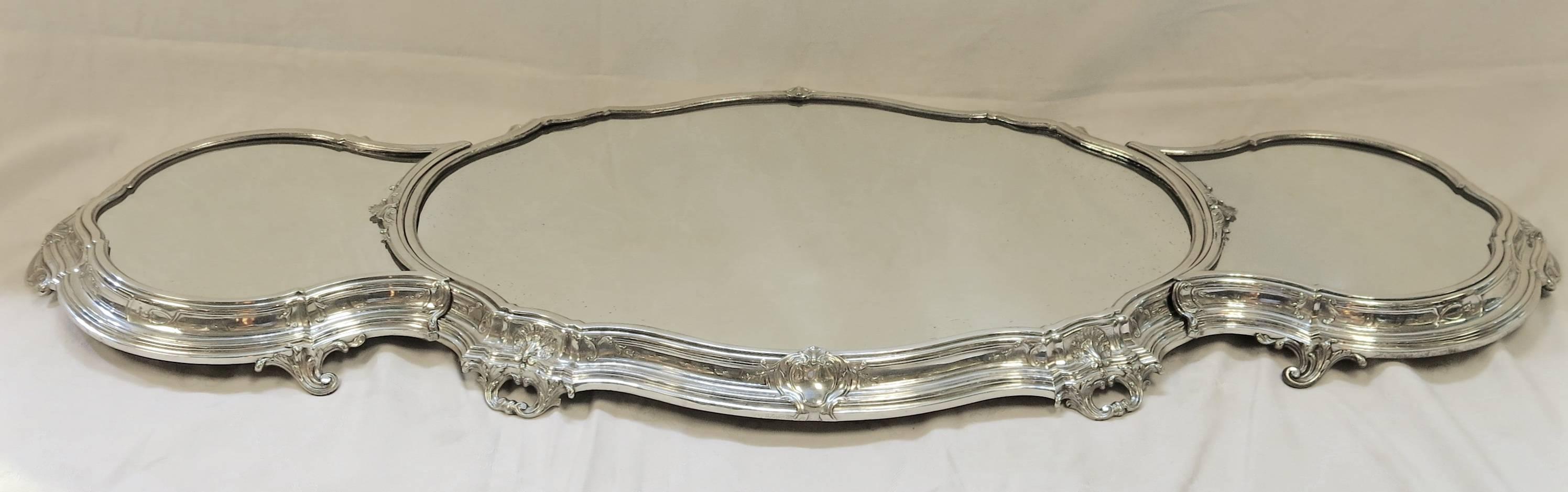 A three section, expandable, sterling silver table plateau. Made in Belgium by the one of the premier silversmiths, Delheid Freres. The plateau is actually the highest grade of silver, being of 950 standard, which is higher than the 925 sterling