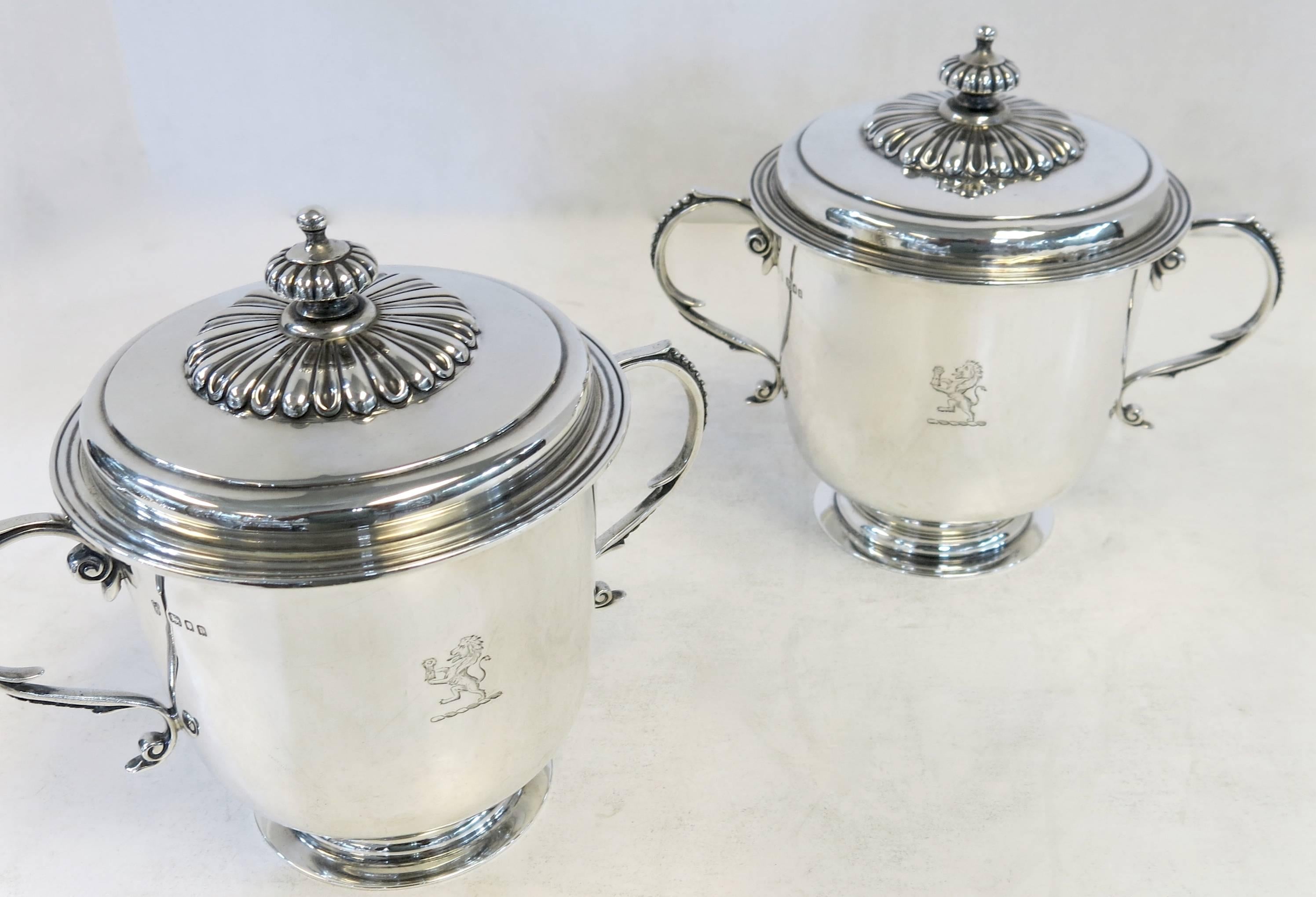 Antique English, sterling silver cup and covers in a Georgian style.
Made by Charles Stewart Harris, London, 1910. 
Both cups are fully and correctly hallmarked, and are hand engraved on one side of each cup with a lion crest. 

Suitable for