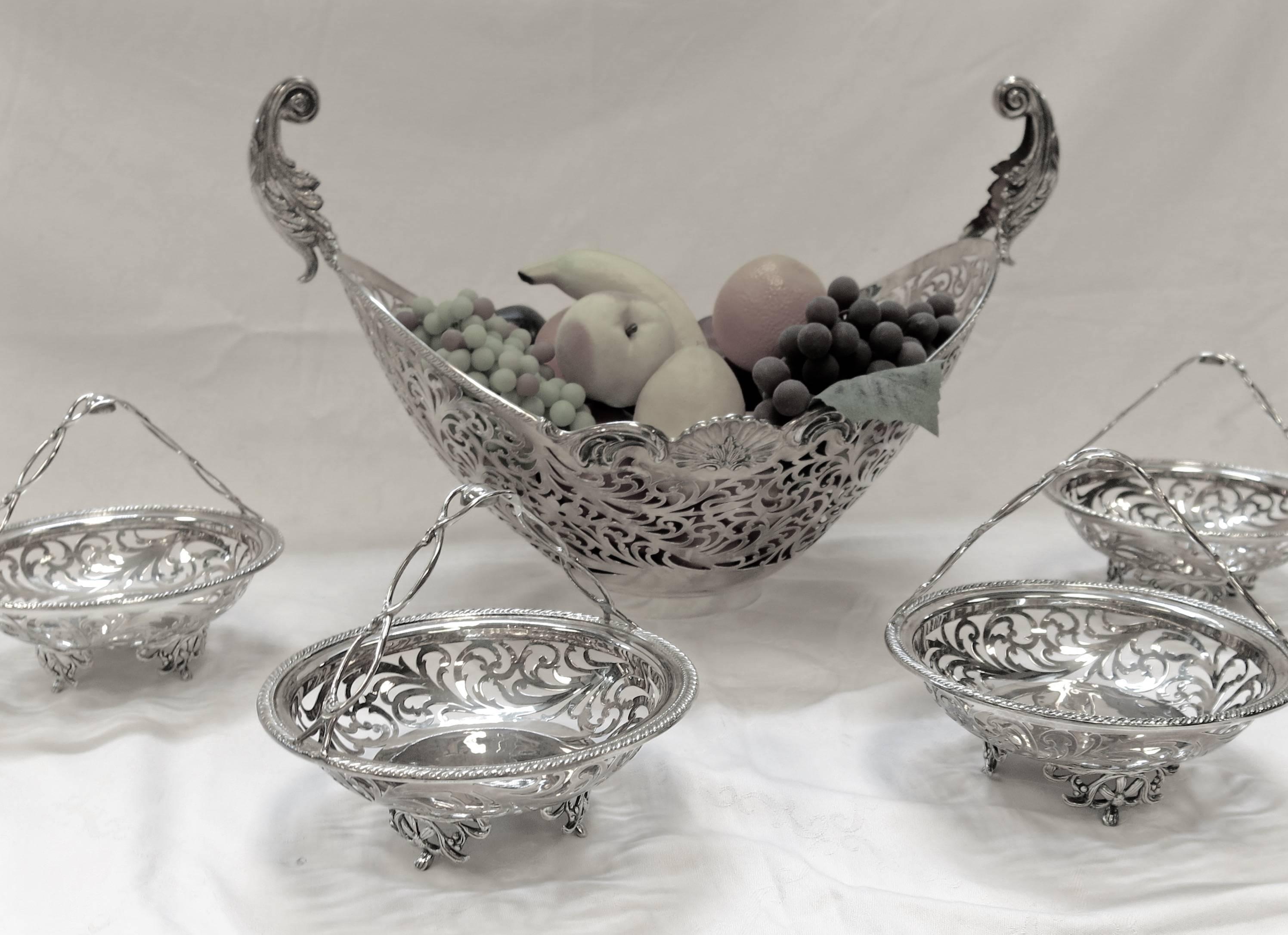 Large, sterling silver, five basket pierced epergne / centrepiece. Handmade for Asprey of London. All the baskets detach and can be used individually. Great for the centre of a large dining table or on a large sideboard. 
Measures: 26.5