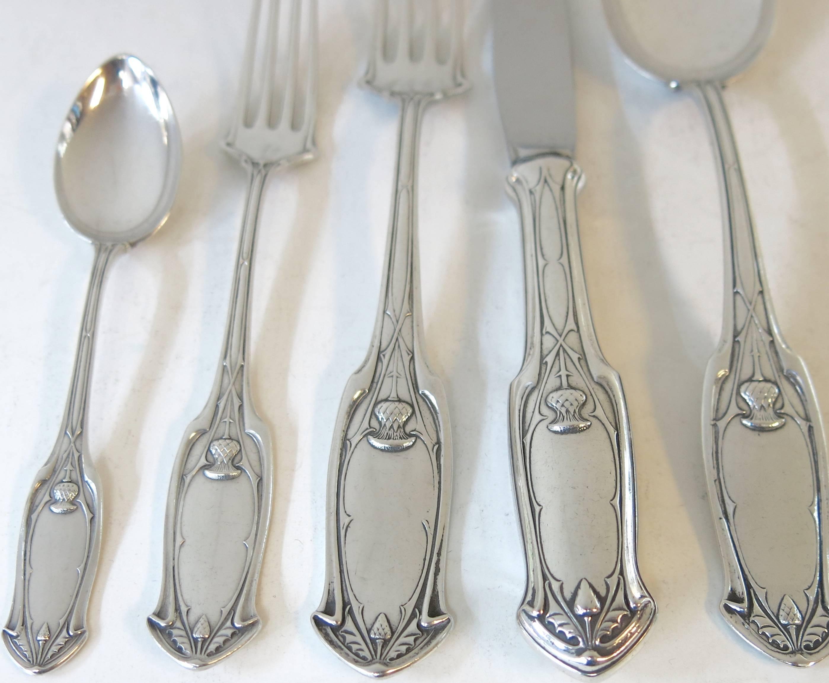 Antique German, 800 silver, flatware set for 12 people. An unusual, custom-made, hand-forged pattern with thistle decoration. Each piece is beautifully hand engraved on one side with the original monogram. Made by S & D Lowenthal. Total of 60