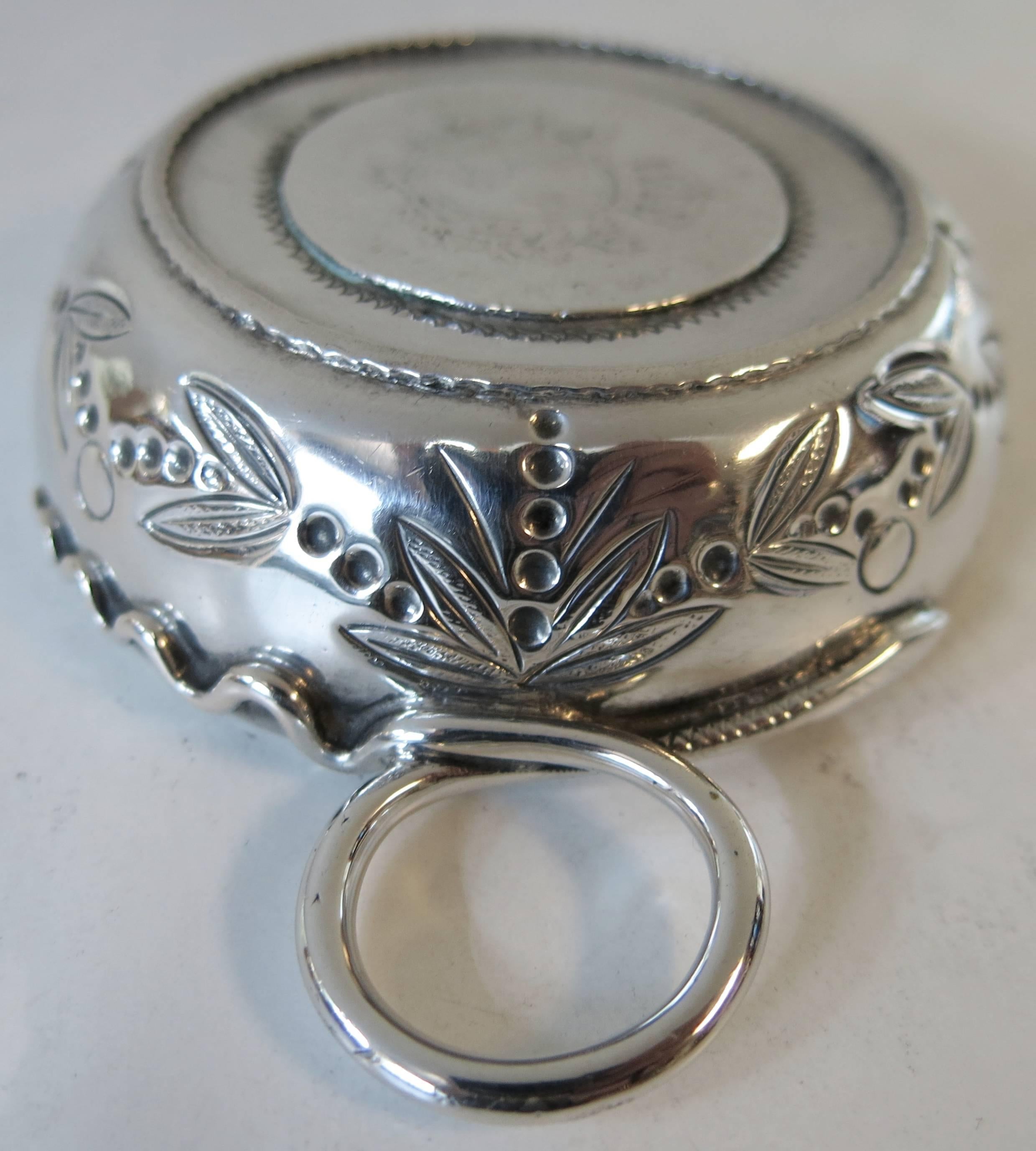 French, antique, sterling silver taste de vin / tastevin / wine taster, with snake
handle and Louis XV coin inset into base.