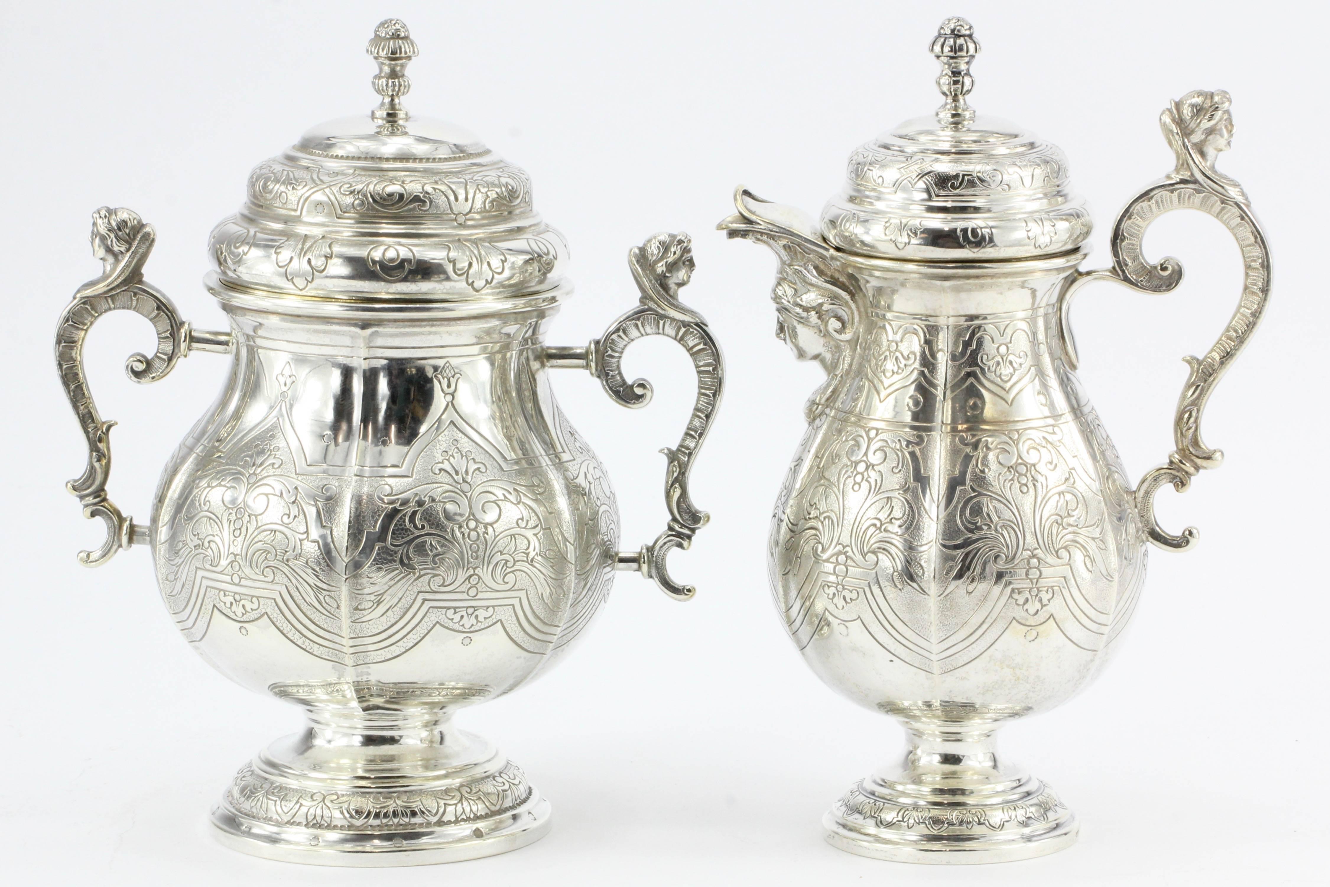 Antique Georg Roth Hanau Germany 800 silver figural revival five-piece tea set, circa 1890

The piece was made in Hanau Germany ins the late 19th century in the Renaissance Revival style. There is a large tea and coffee pot as well as a covered