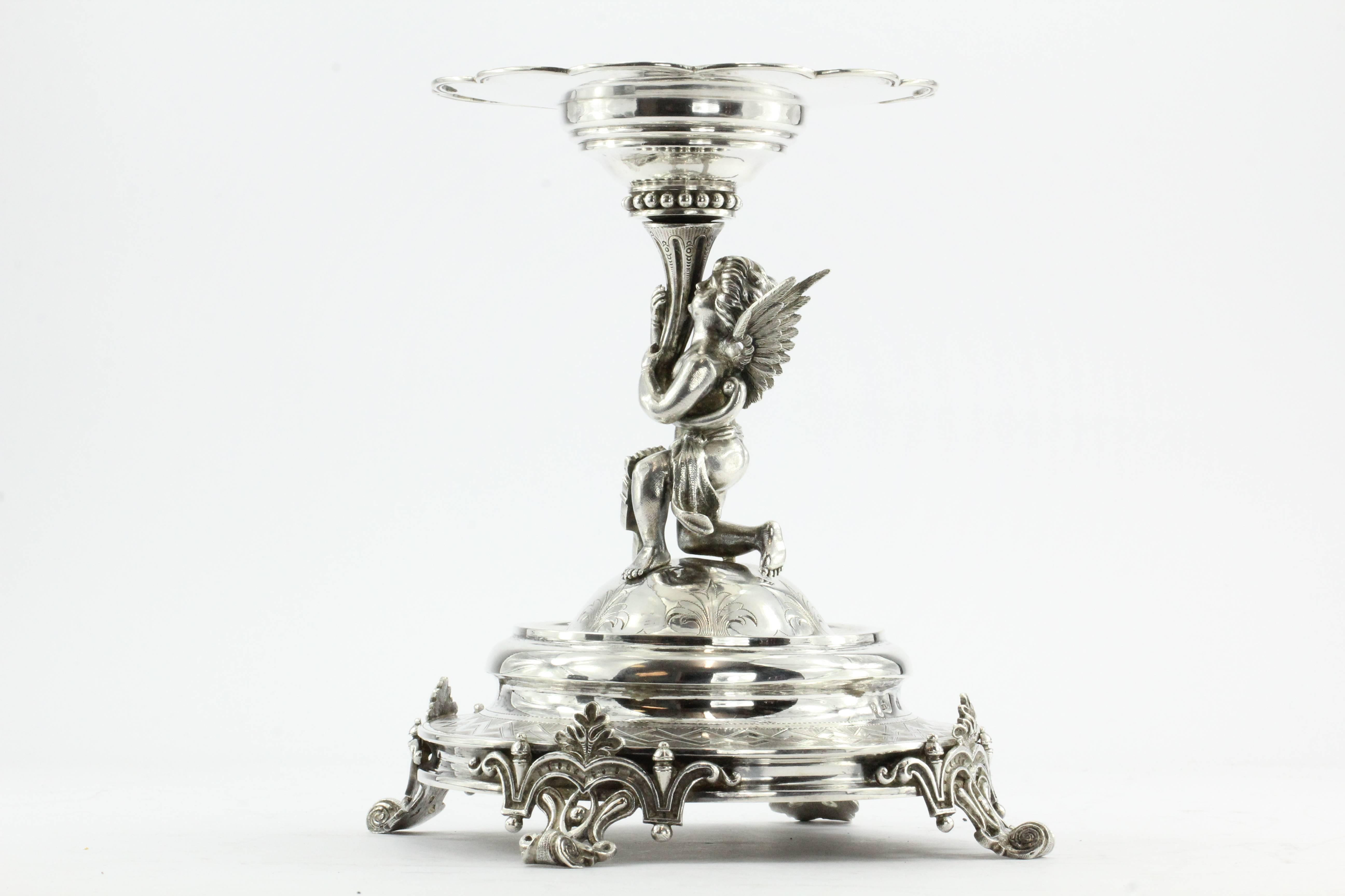 Antique Austrian imperial 800 silver figural cupid cherub angel tazza compote. The piece is in great estate condition and ready to use. There is a deep scratch the underside of the tray though. Please see pictures for details. The piece is very much