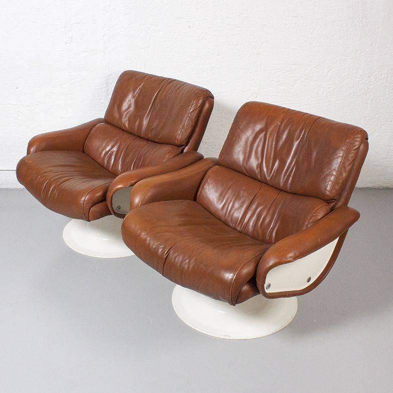 Pair of molded plastic, fiberglass and leather Saturn lounge chairs by Yrjo Kukkapuro. Original beautifully patinated leather.