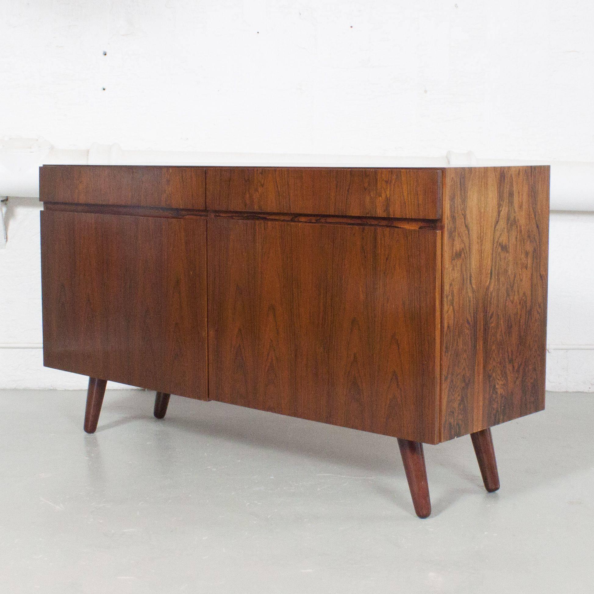 Dark rosewood credenza attributed to Ib Kofod–Larsen.