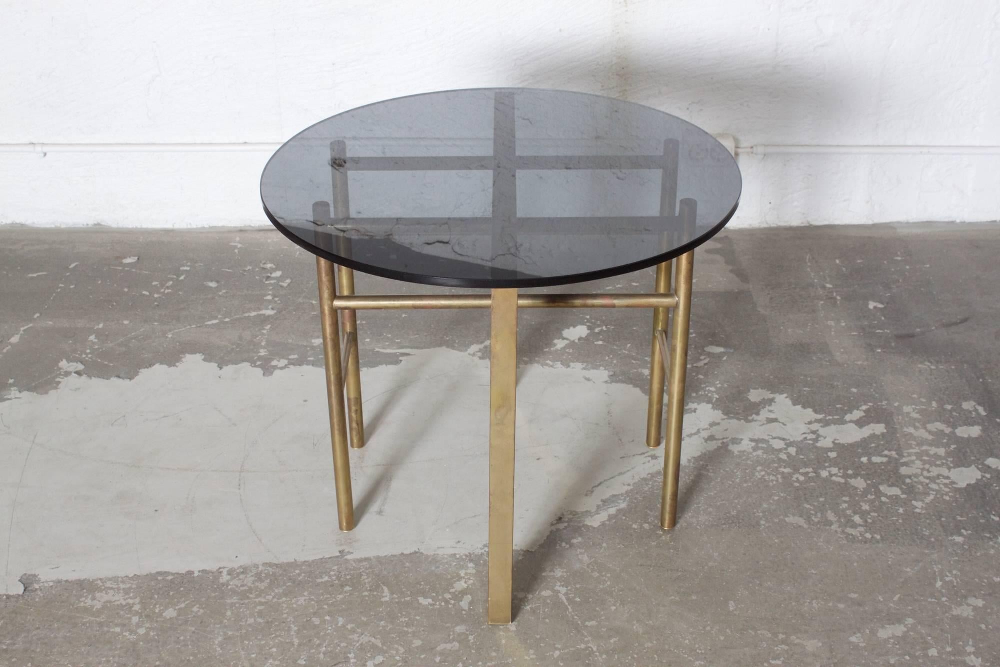 Small side table with brass base and a smoked glass top.
France, 1960s. 