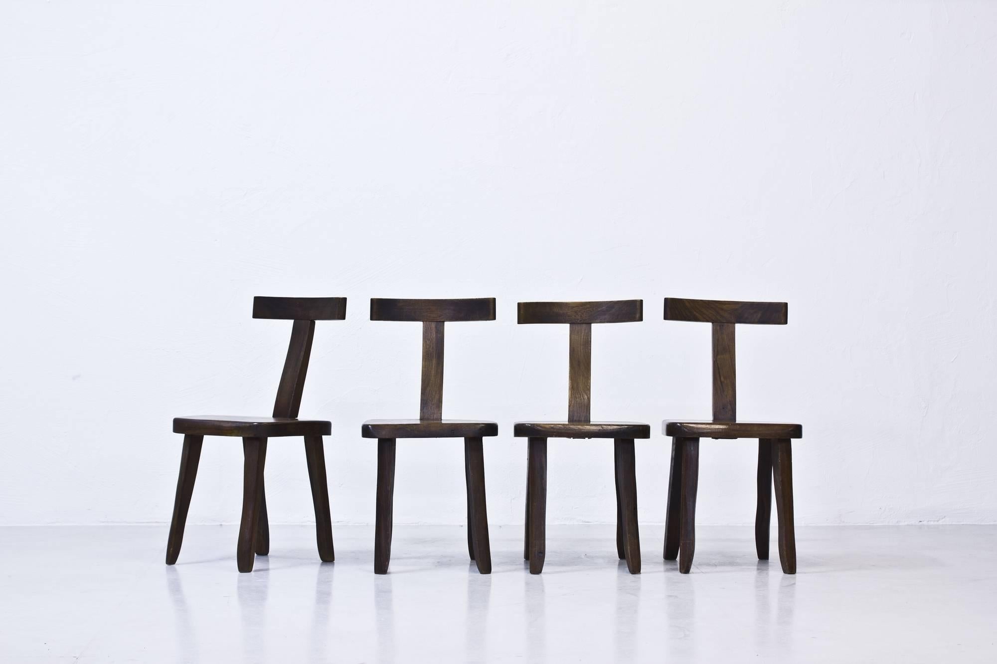 This set of four chairs was designed by Olavi Hanninen for Mikko Nupponen in Finland in the 1950s. They are made from teak with 'T' shaped backrests. This set is in good vintage condition.