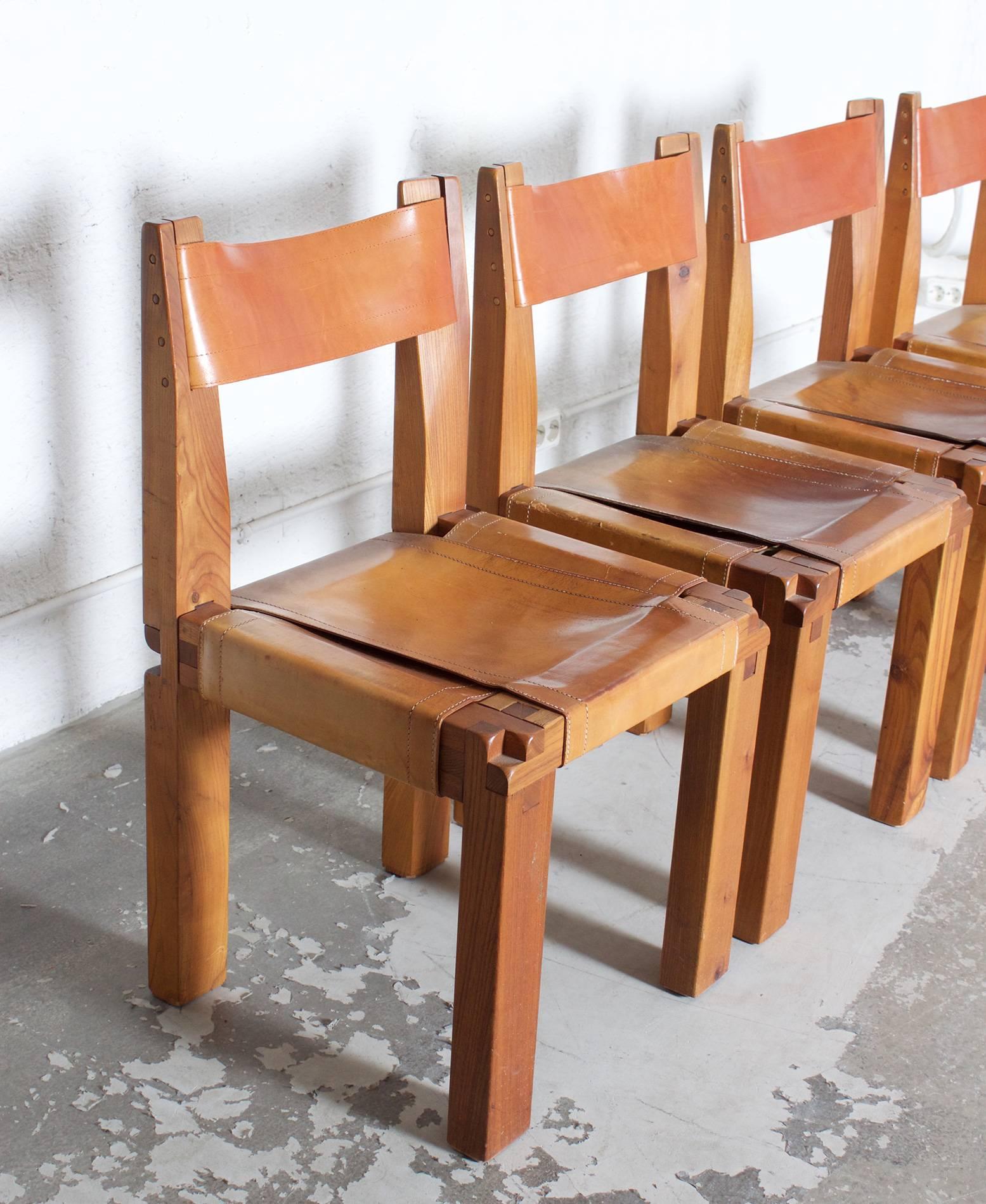 Set of four solid ashwood and leather chairs by Pierre Chapo.