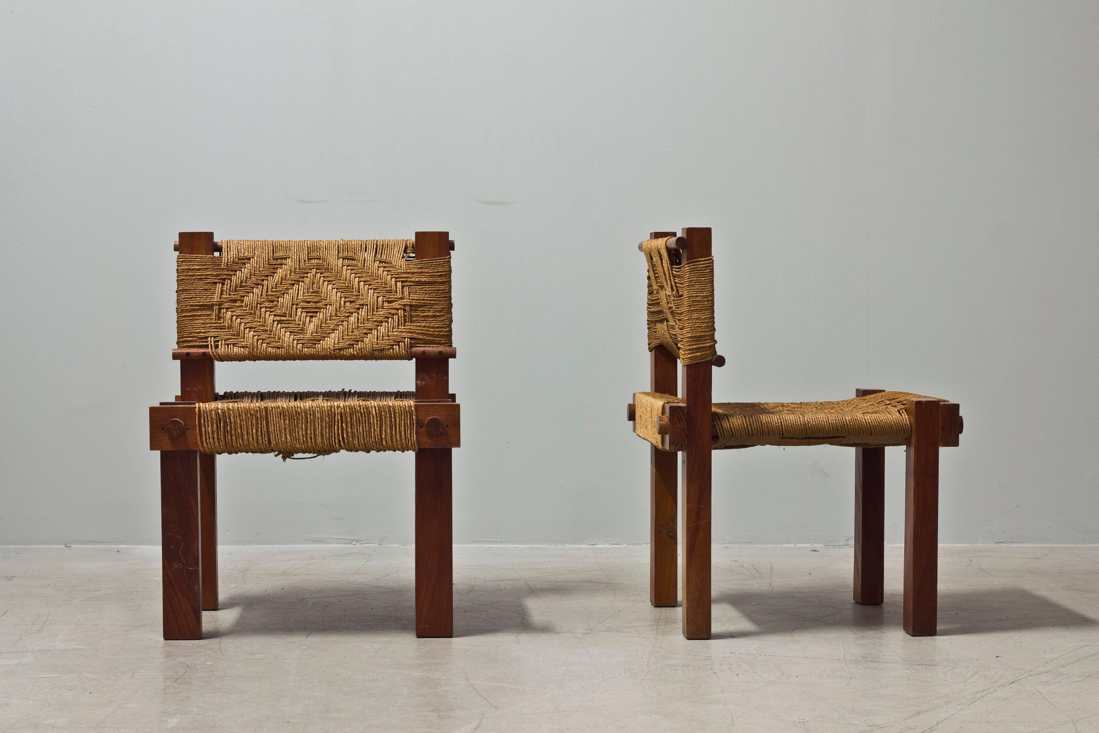 A pair of wood and rope chairs by Adoux and Minet, France 1950s. Sold as a pair.

Year: 1950s.
Country: France.
Condition: Vintage condition.

Dimensions:

H: 71 cm
D: 51 cm
W: 53 cm.