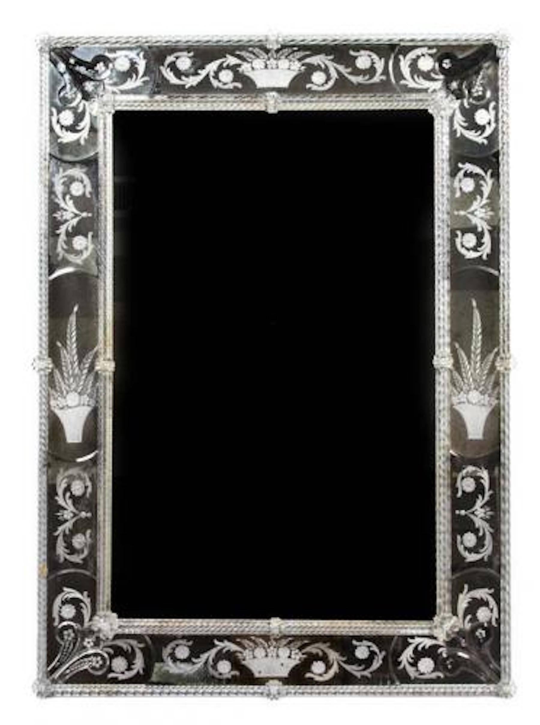 Venetian engraved mirror, of rectangular form, with fine engravings of baskets of flowers and plants.