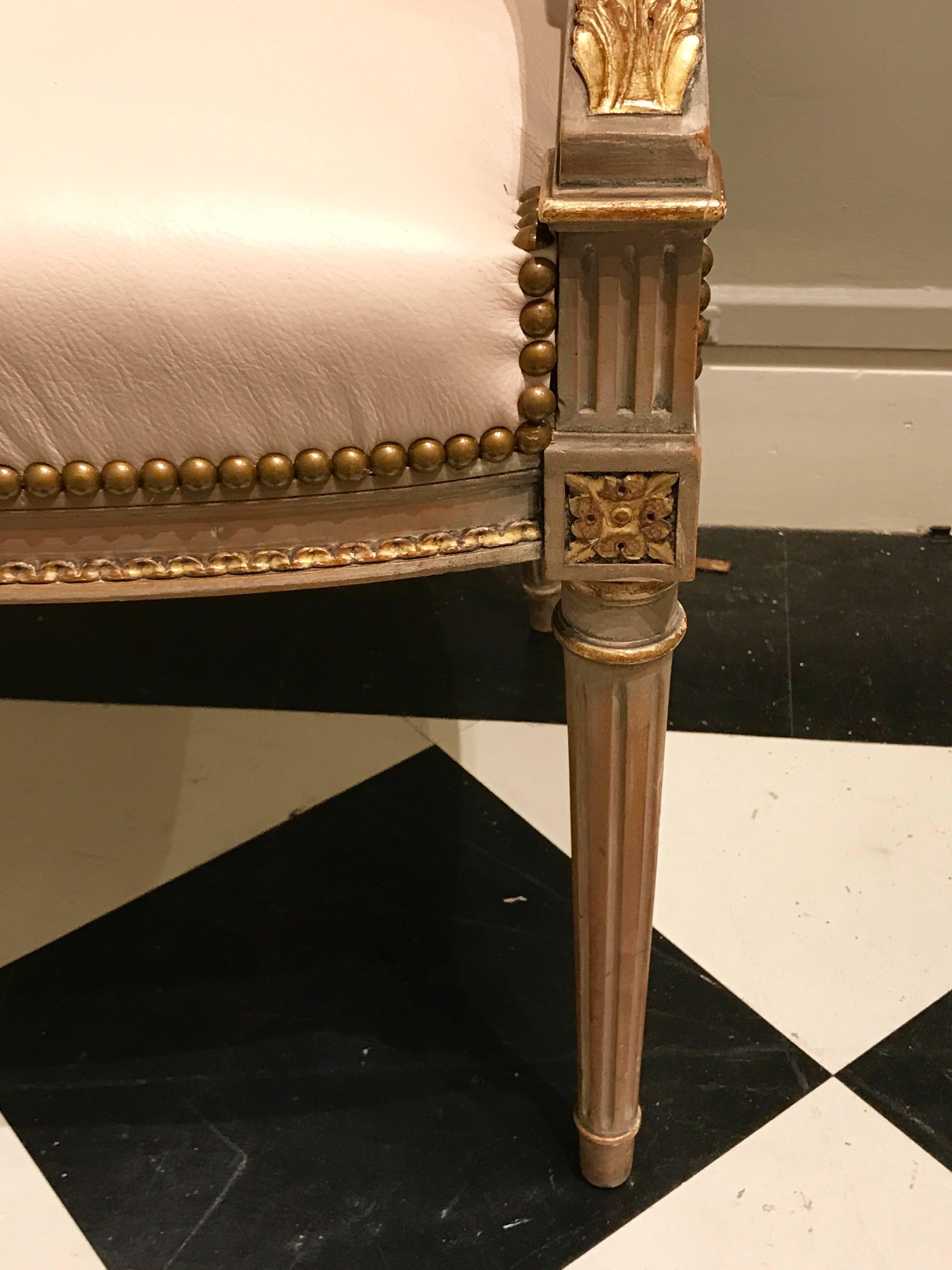 Four Maison Jansen Louis XVI Cream Leather Upholstered Parcel-Gilt Armchairs 1