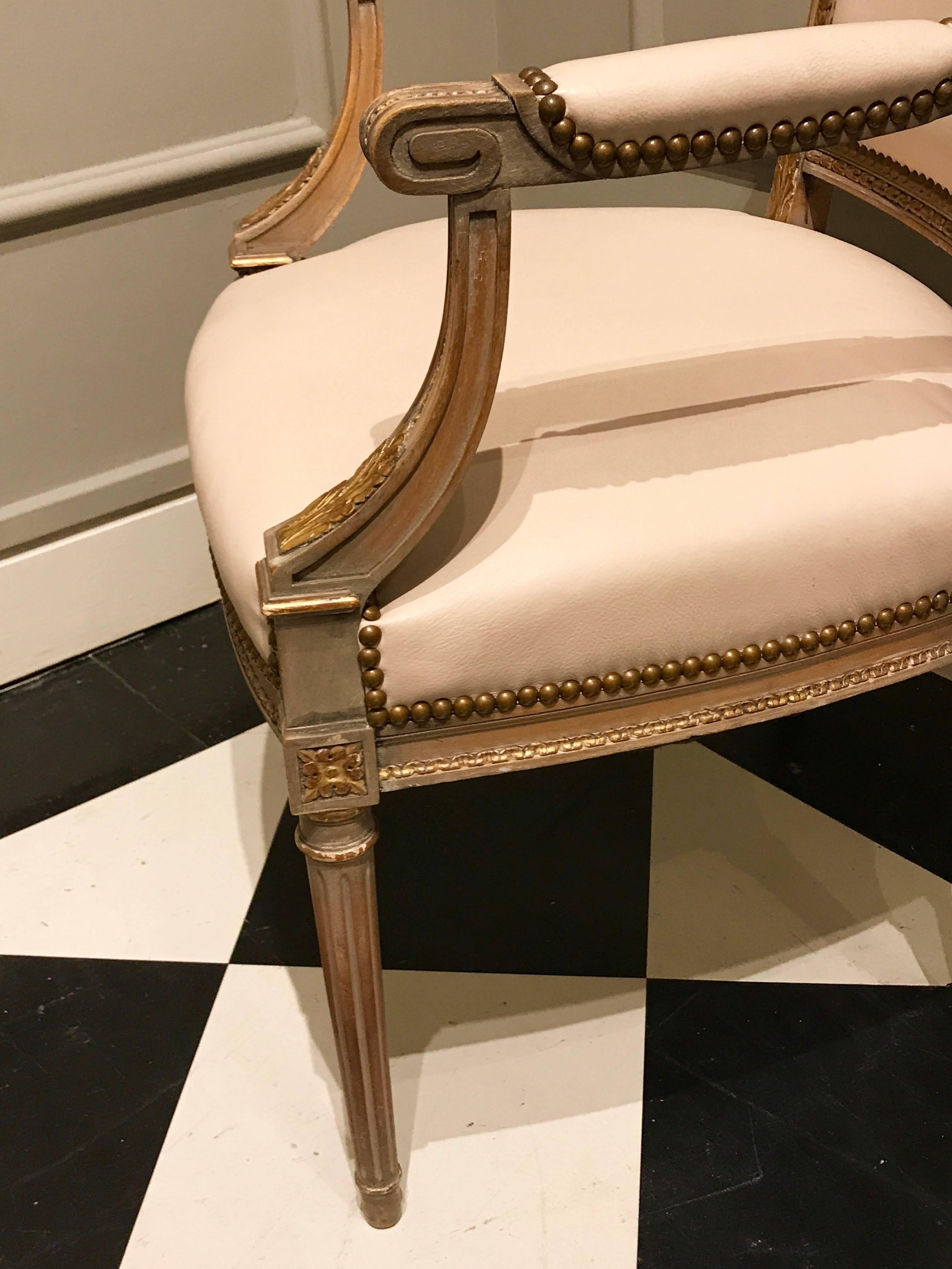 Mid-20th Century Four Maison Jansen Louis XVI Cream Leather Upholstered Parcel-Gilt Armchairs