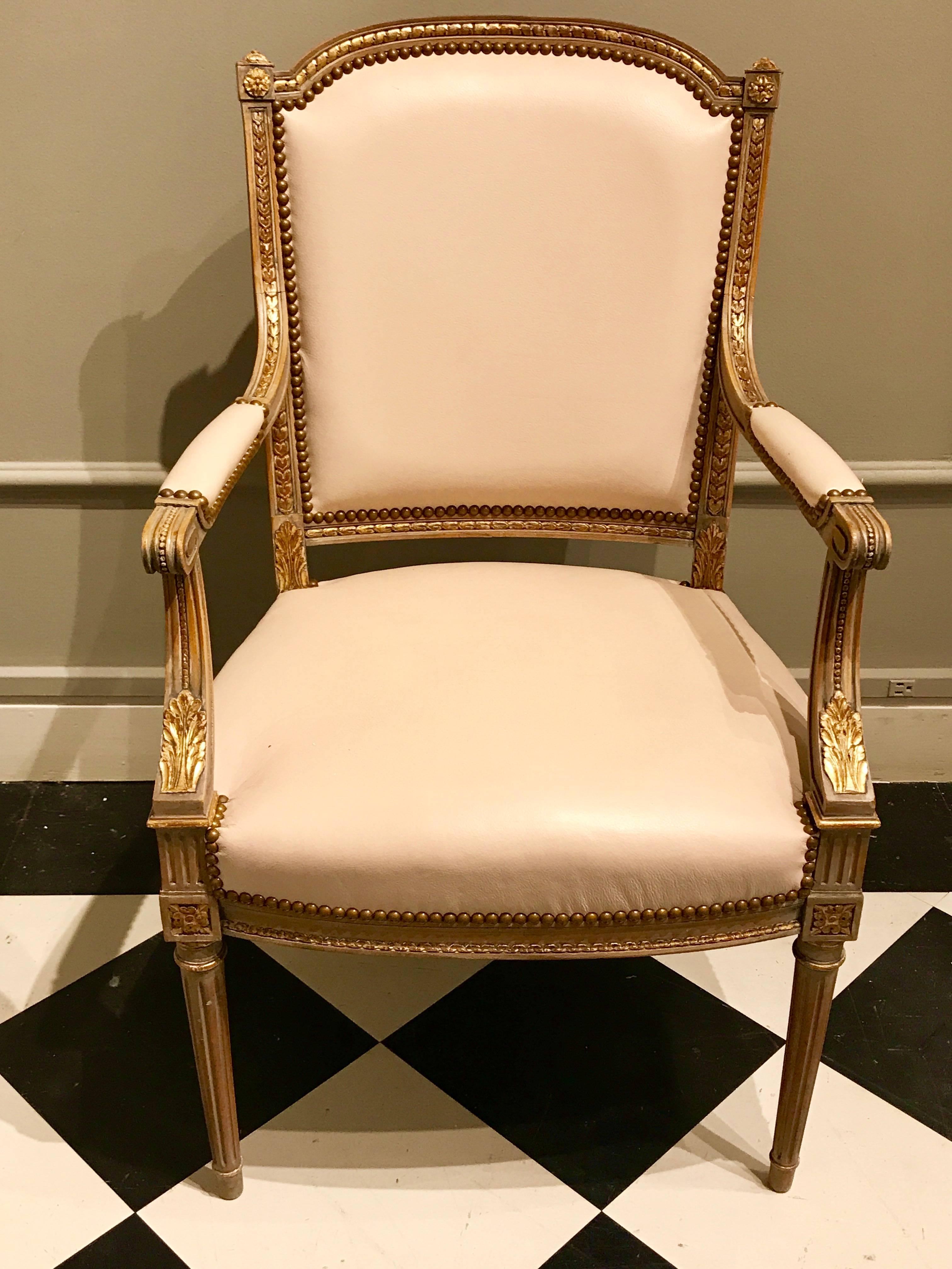 French Four Maison Jansen Louis XVI Cream Leather Upholstered Parcel-Gilt Armchairs