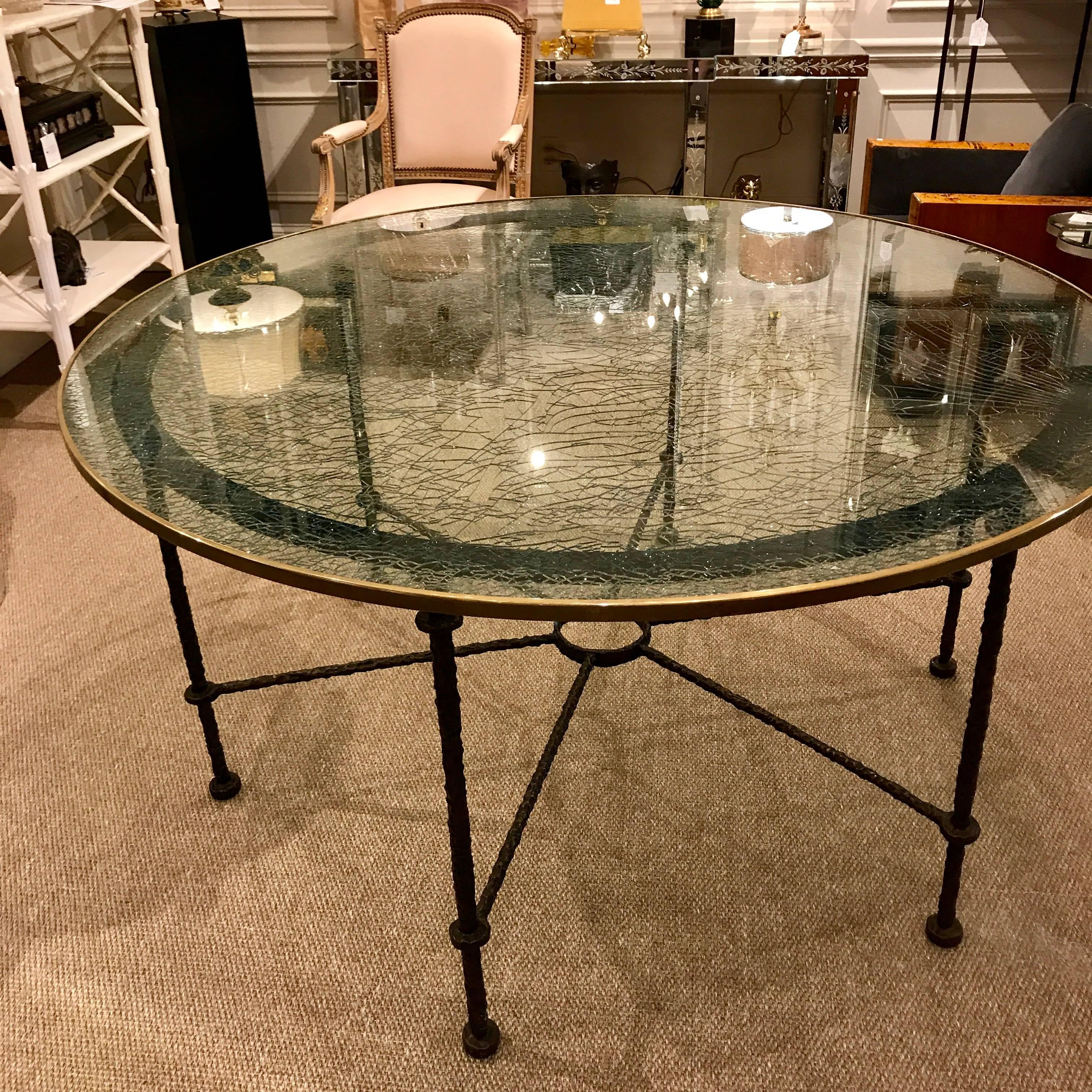 Giacometti style bronze dining table. A magnificent 59" diameter bronze-mounted crackle/ fractured circular glass top resting on a cast bronze six legged Giacometti style table base from the NJ estate of R & B legend Luther Vandross.