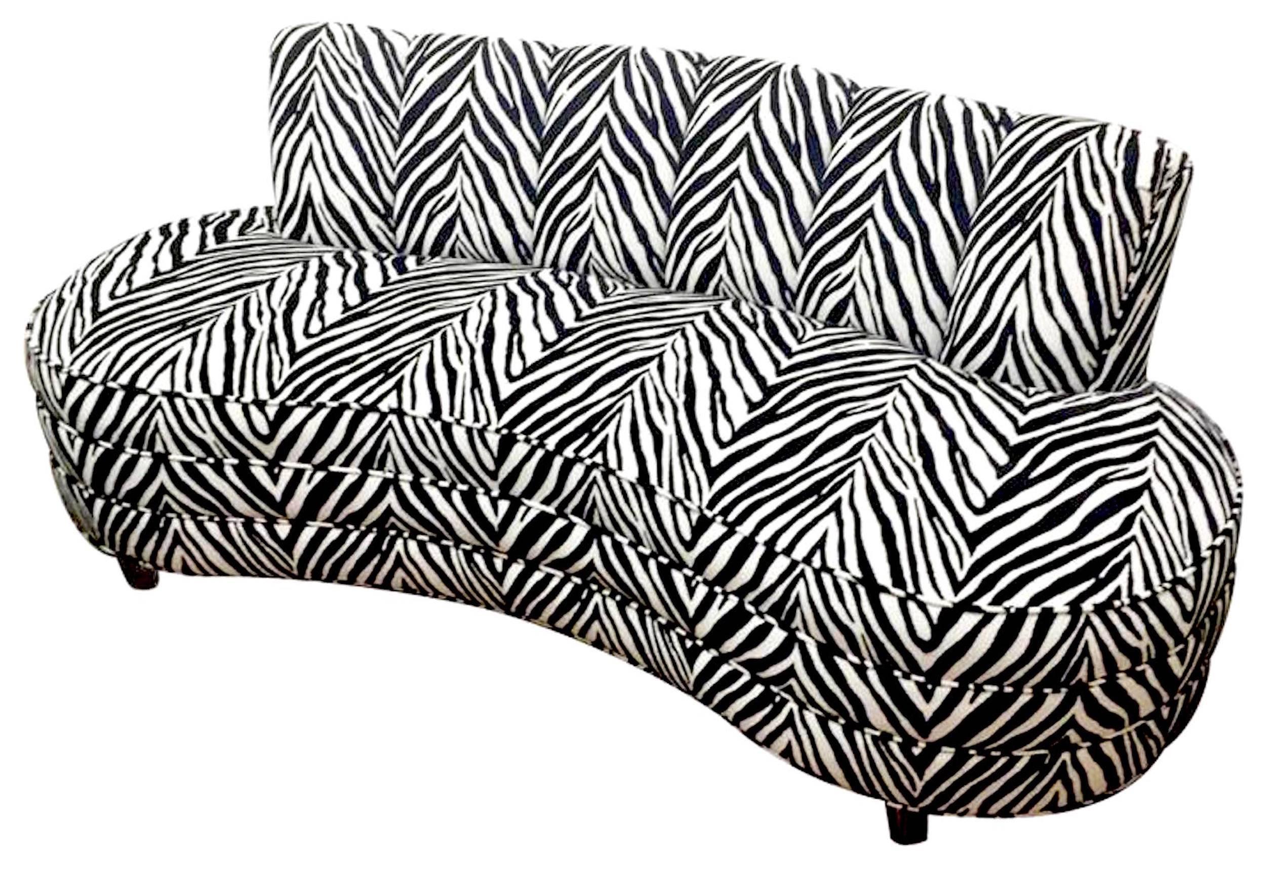 Custom midcentury zebra pattern sofa,of iconic form, raised on lucite legs.

 