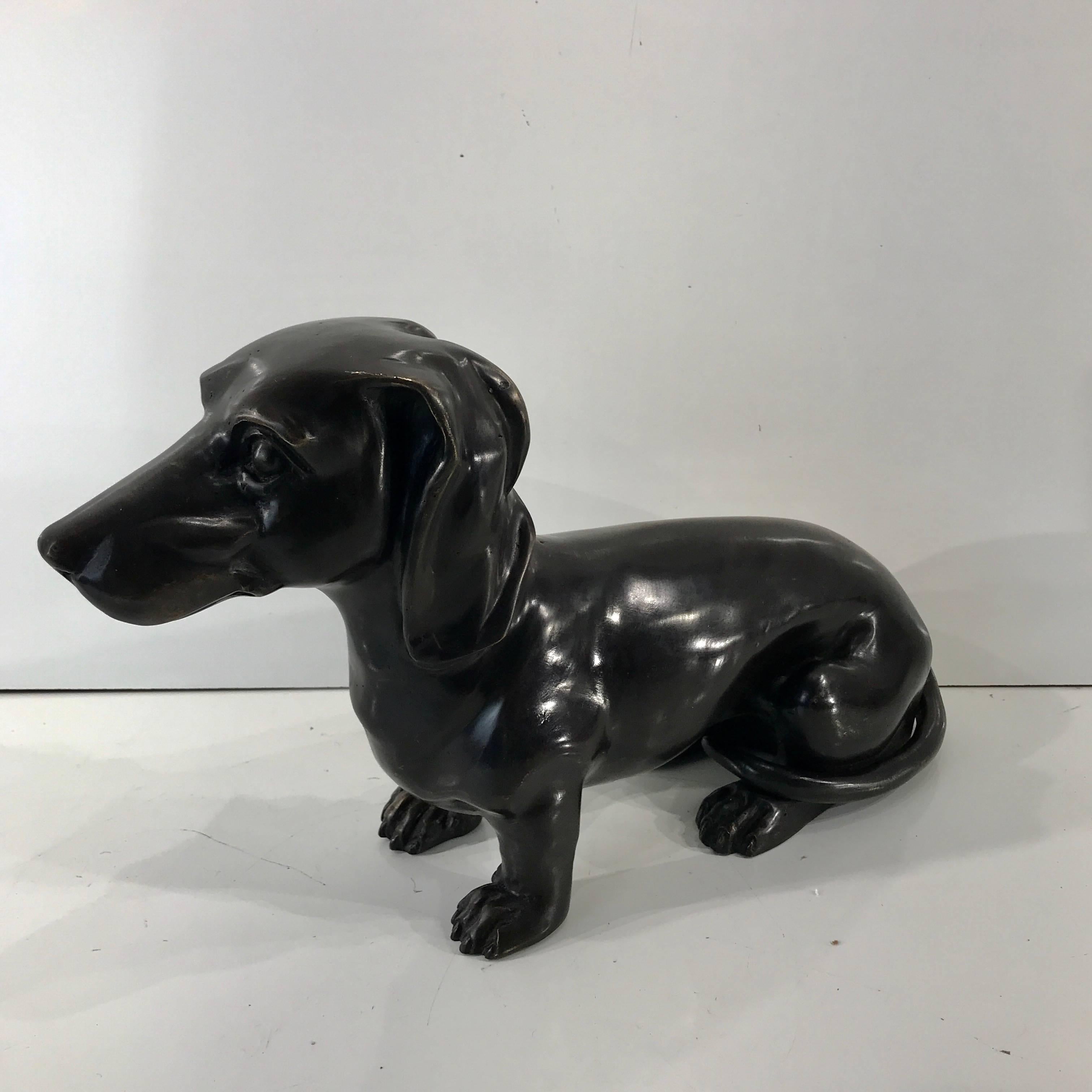 Midcentury bronze figure of a Seated Dachshund, nicely cast and modeled, unsigned. The base measures 10.5