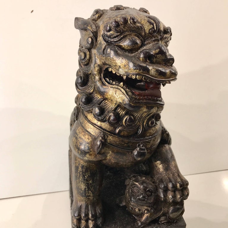 Pair of Chinese Carved Wood and Giltwood Foo Dogs at 1stDibs
