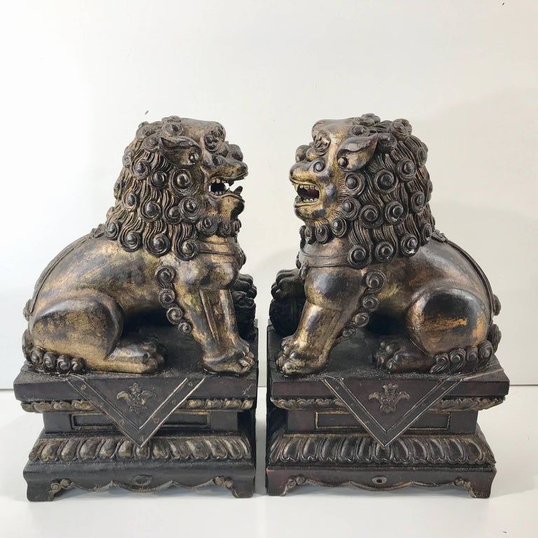 Pair of Chinese Carved Wood and Giltwood Foo Dogs at 1stDibs