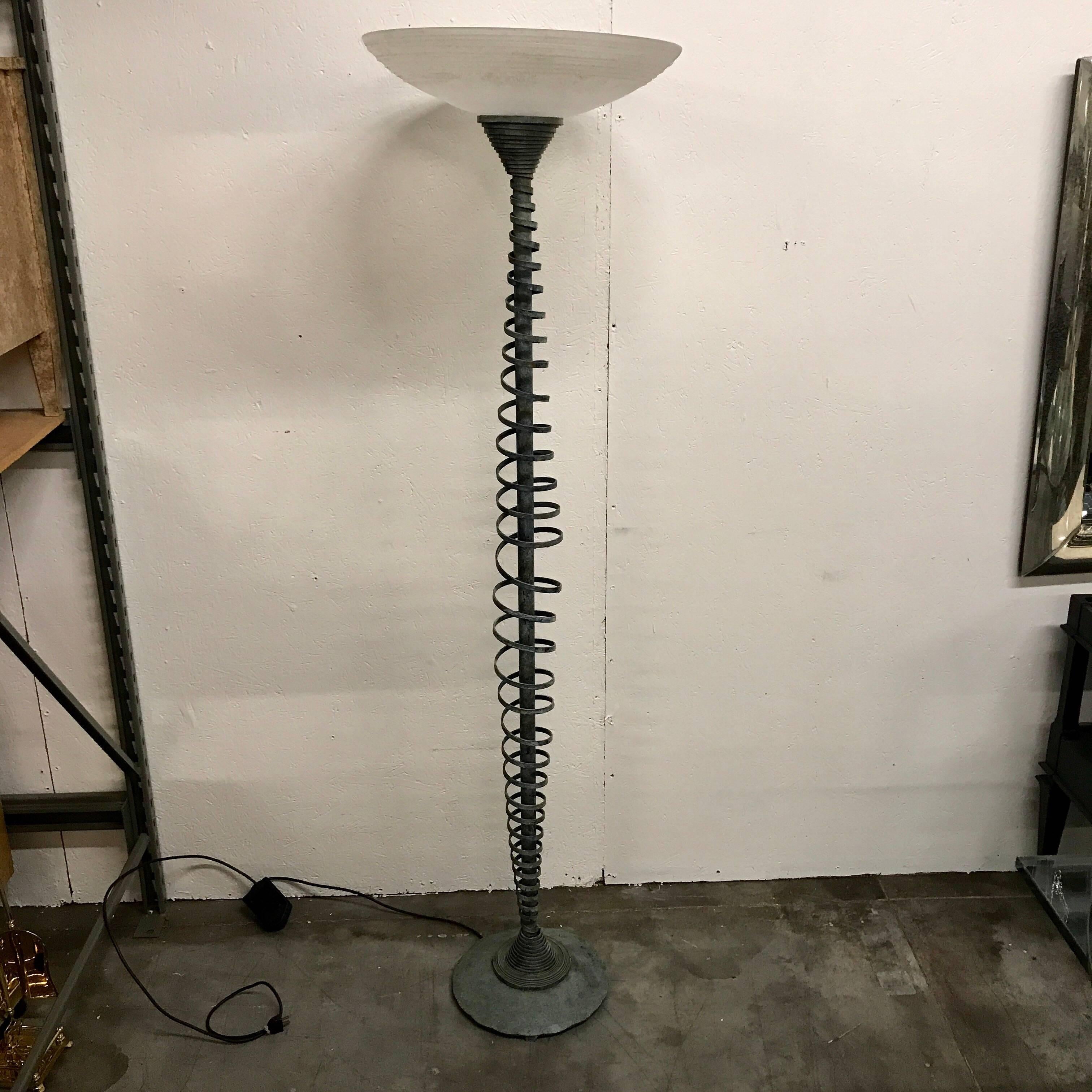 Italian midcentury Murano glass and kinetic bronze floor lamp, fitted with an opaque Murano glass shade, on a cast verdigris bronze circular moveable spiral column. The base has a 12