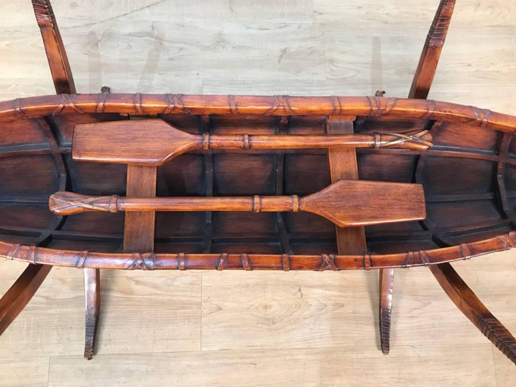 Folk Art style Canoe wood and iron sculpture as a coffee table. Realistically carved canoe (17.5