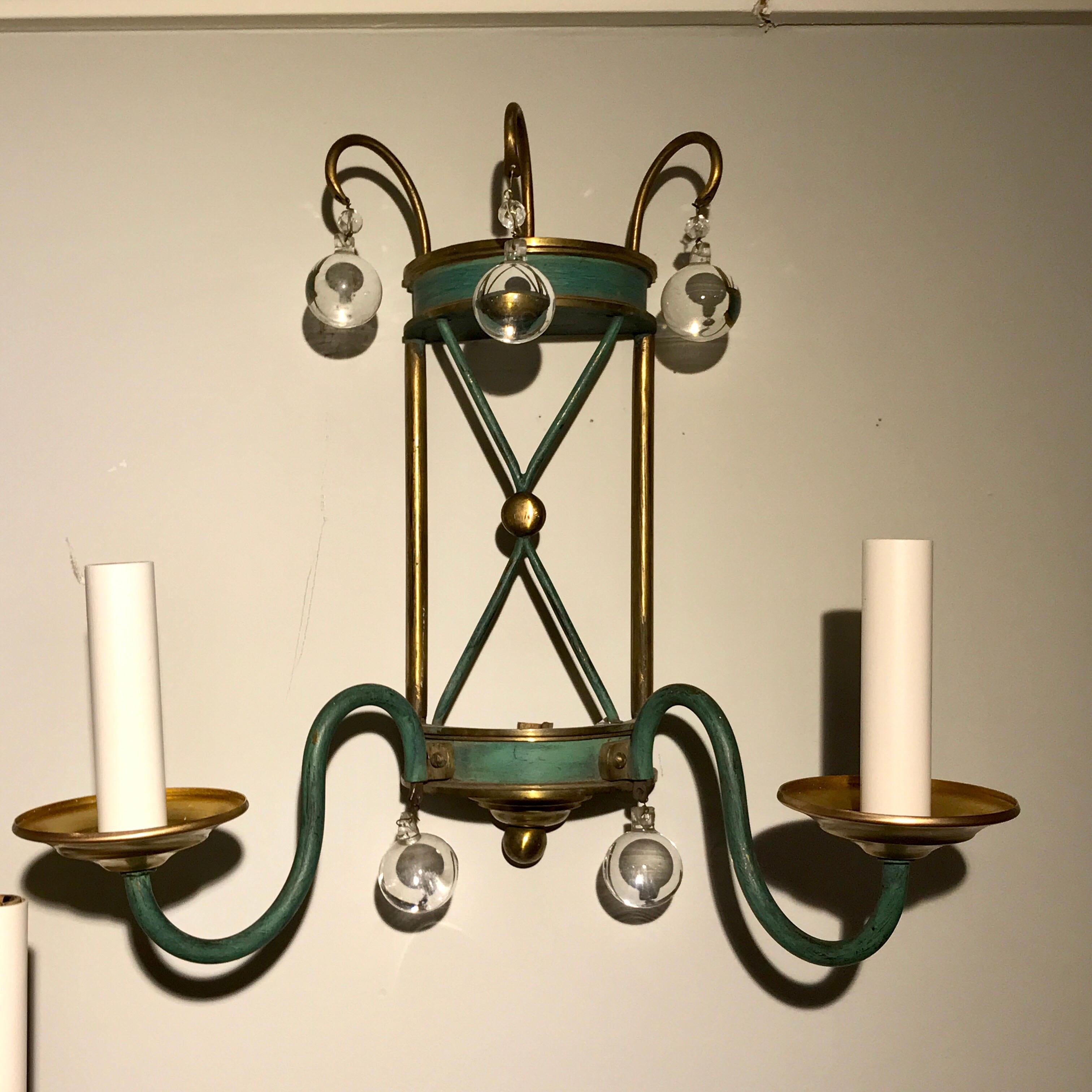 Pair of French modern wall sconces, second pair available, each one with two lights and crystal spheres, in brass and verdigris patina. Newly electrified.