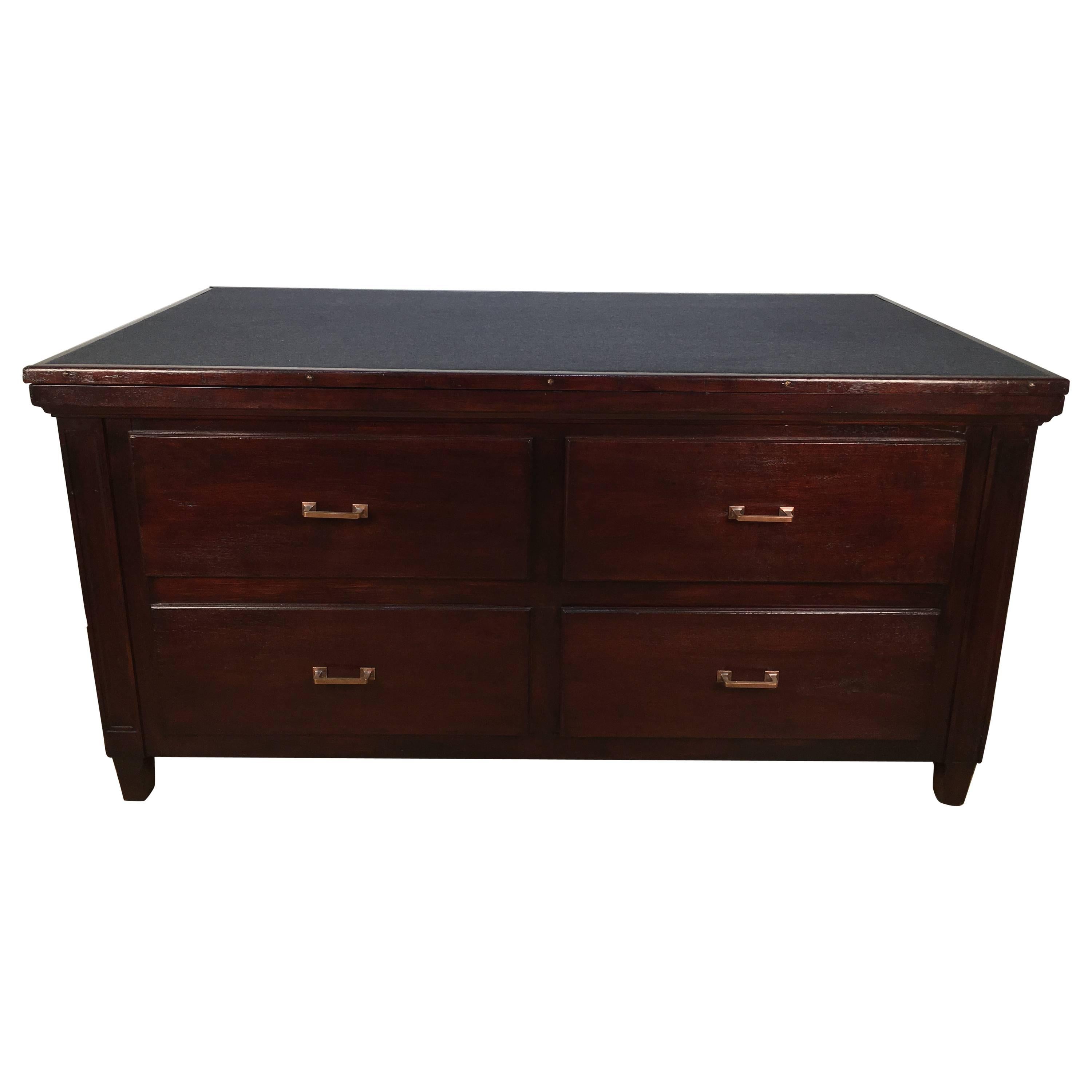 Antique drafting desk or store fixture, The adjustable tilt-top with dark grey inset fabric. Possibly could have been in a mercantile store, used for fabric sales or the like. One side has four deep drawers and opposite side has an upper drawer and