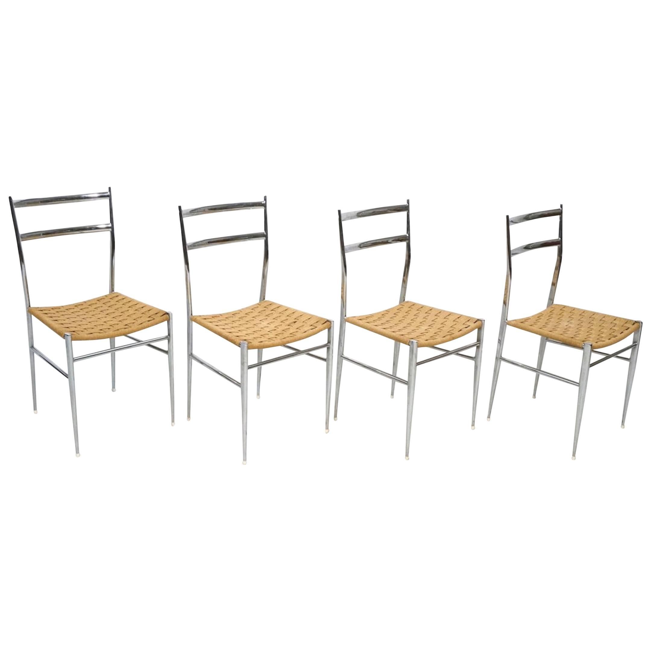 Four Gio Ponti style chrome and grass seat chairs, each one with two back slats and thick woven grass seats, retains 