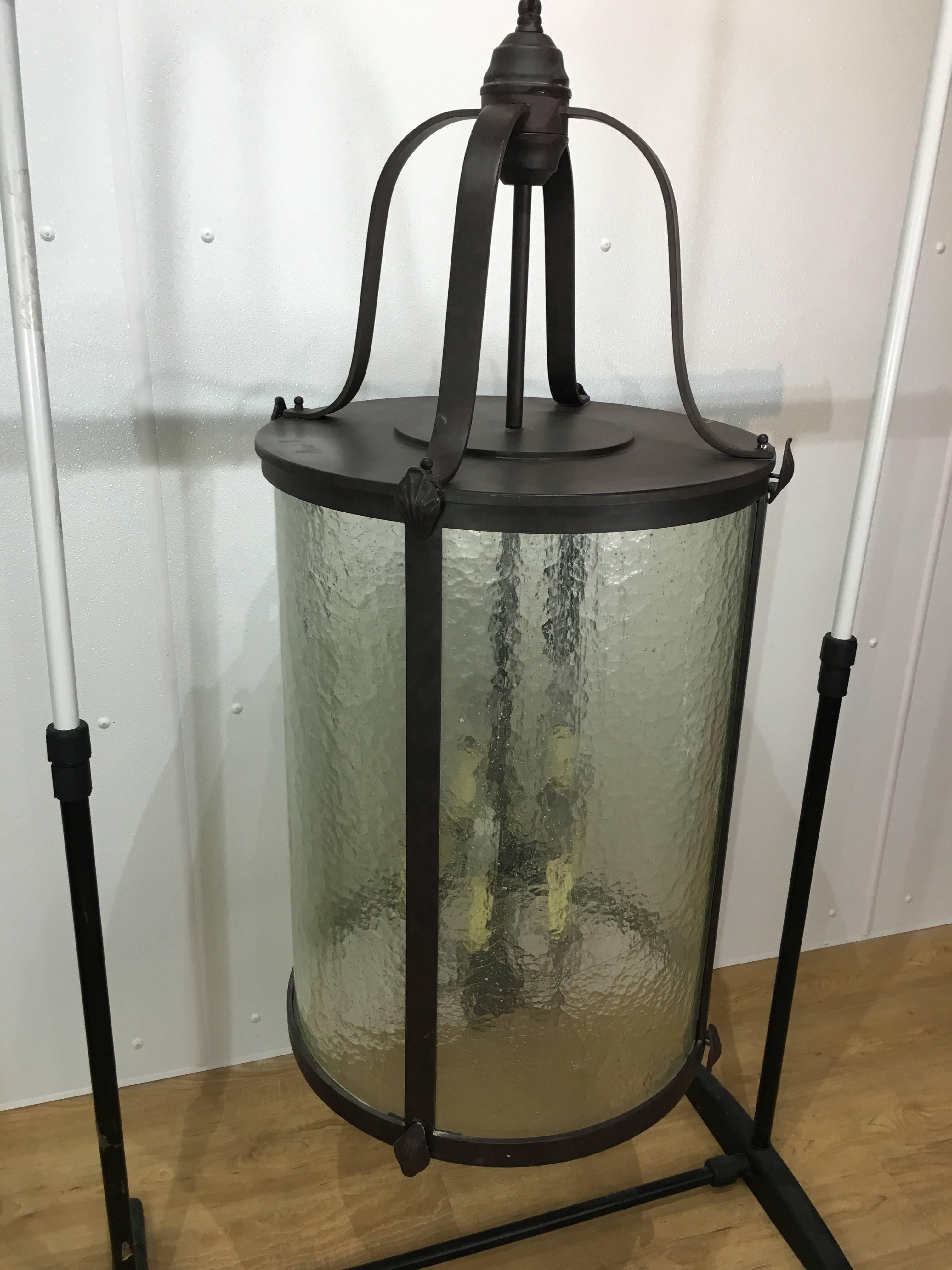 Large nine-light neoclassical style lantern, of typical form enameled earth tone wrought iron with 