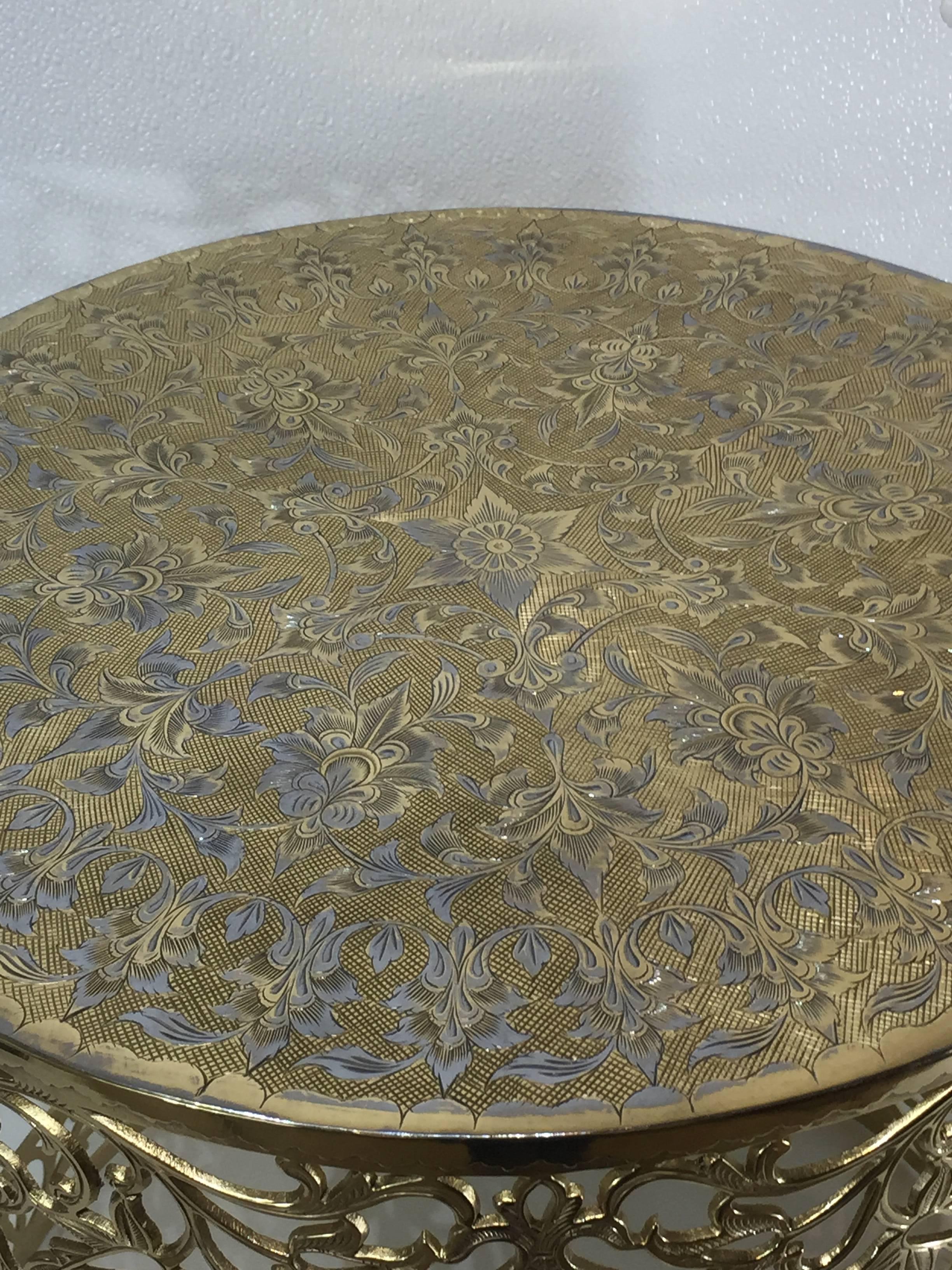Syrian brass garden seat with silver inlay, of circular form with intricate casting and engraving.